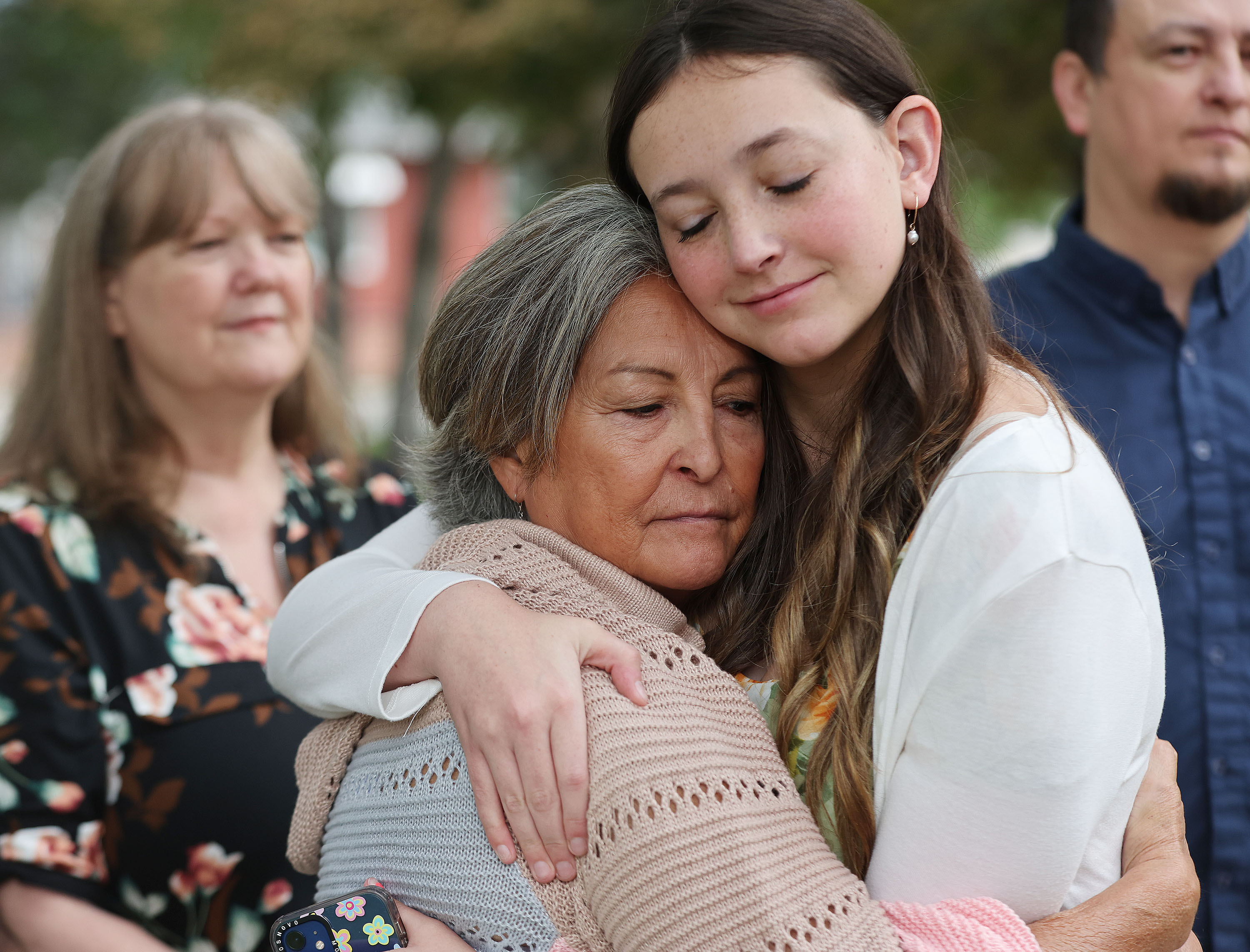 Brenda Robbs hugs her great-niece Lexi Waters as family members held a press conference Wednesday in Salt Lake City to discuss the 1980 killing of their relative. Salt Lake police are looking for further help in the investigation.