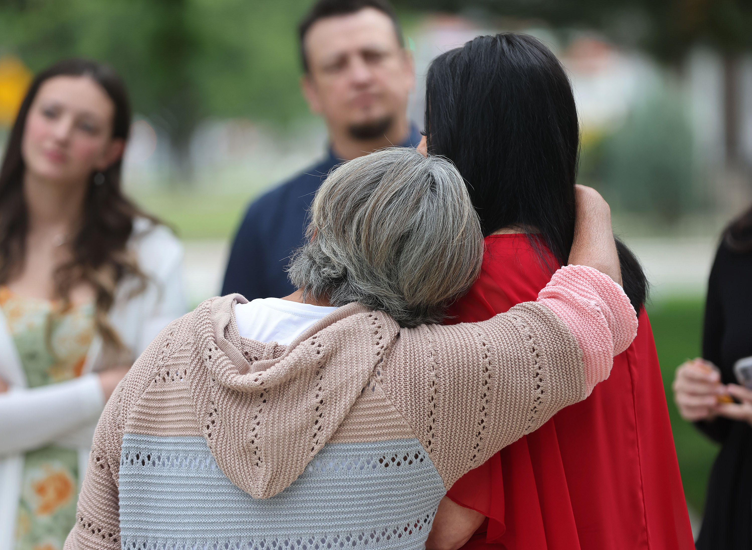 Brenda Robbs, granddaughter to Celedon Archuleta, left, hugs her cousin Angie Bryan as family members hold a press conference to discuss the 1980 killing of Archuleta in Salt Lake City on Wednesday.  Salt Lake police are looking for further help in the investigation.