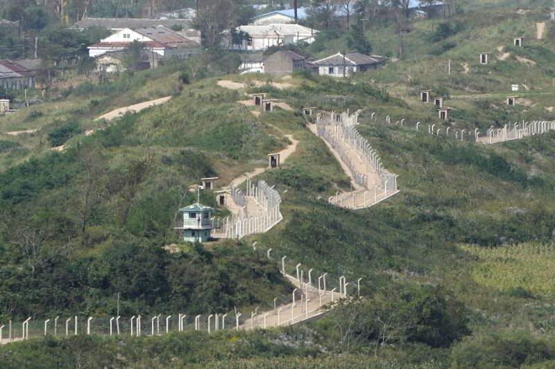 Guard posts and fences ring a hill side on the North Korea border with Russia and China seen from China's Yiyanwang Three Kingdoms viewing platform in Fangchuan in northeastern China's Jilin province Tuesday.