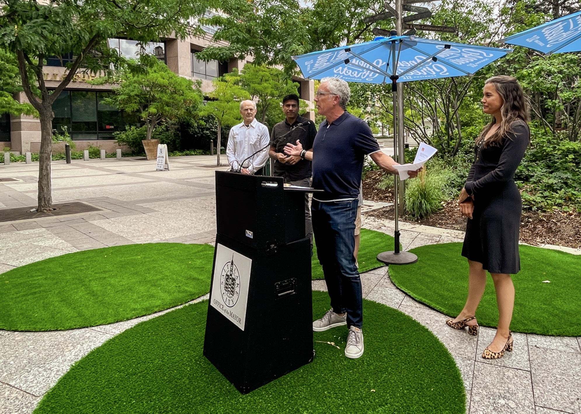 Dee Brewer, director of the Salt Lake City Downtown Alliance, speaks beside Salt Lake City leaders at a press conference Wednesday promoting Open Streets. The street will be closed to cars from noon to 1 a.m. every Friday and Saturday beginning this weekend and continuing through Oct. 28.