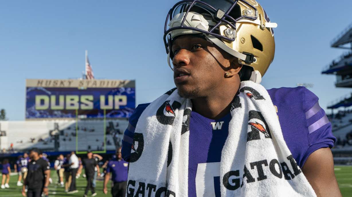 Washington quarterback Michael Penix Jr. walks on the field after a win over Tulsa in an NCAA college football game Saturday, Sept. 9, 2023, in Seattle.
