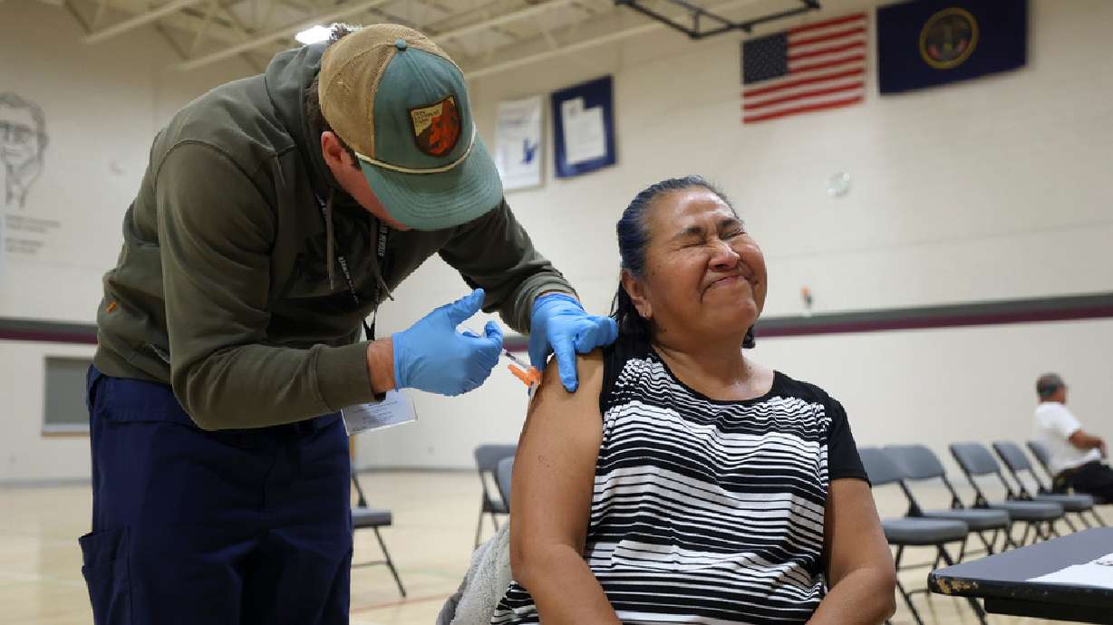 Ana Enriquez gets a COVID-19 booster shot at the Sanderson Community Center in Taylorsville on Nov. 9, 2022. The updated COVID-19 vaccine should be available as soon as the end of the week.