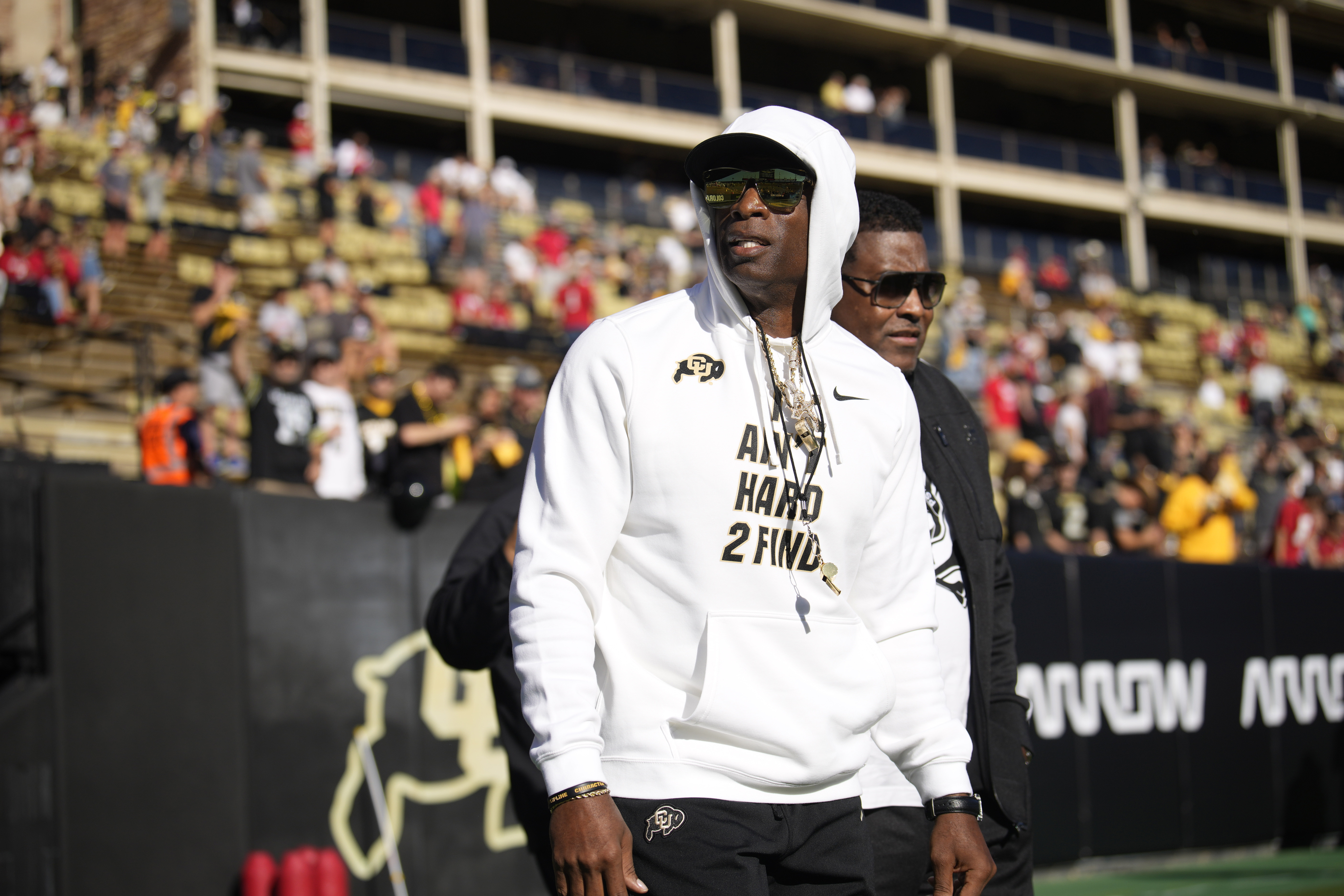 Colorado head coach Deion Sanders walks the perimeter of Folsom Field before an NCAA college football game against Nebraska Saturday, Sept. 9, 2023, in Boulder, Colo. 