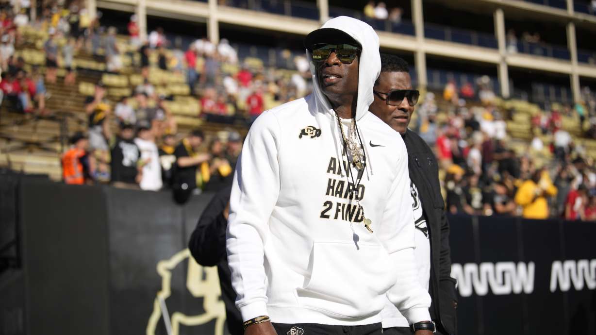 Colorado head coach Deion Sanders walks the perimeter of Folsom Field before an NCAA college football game against Nebraska Saturday, Sept. 9, 2023, in Boulder, Colo.