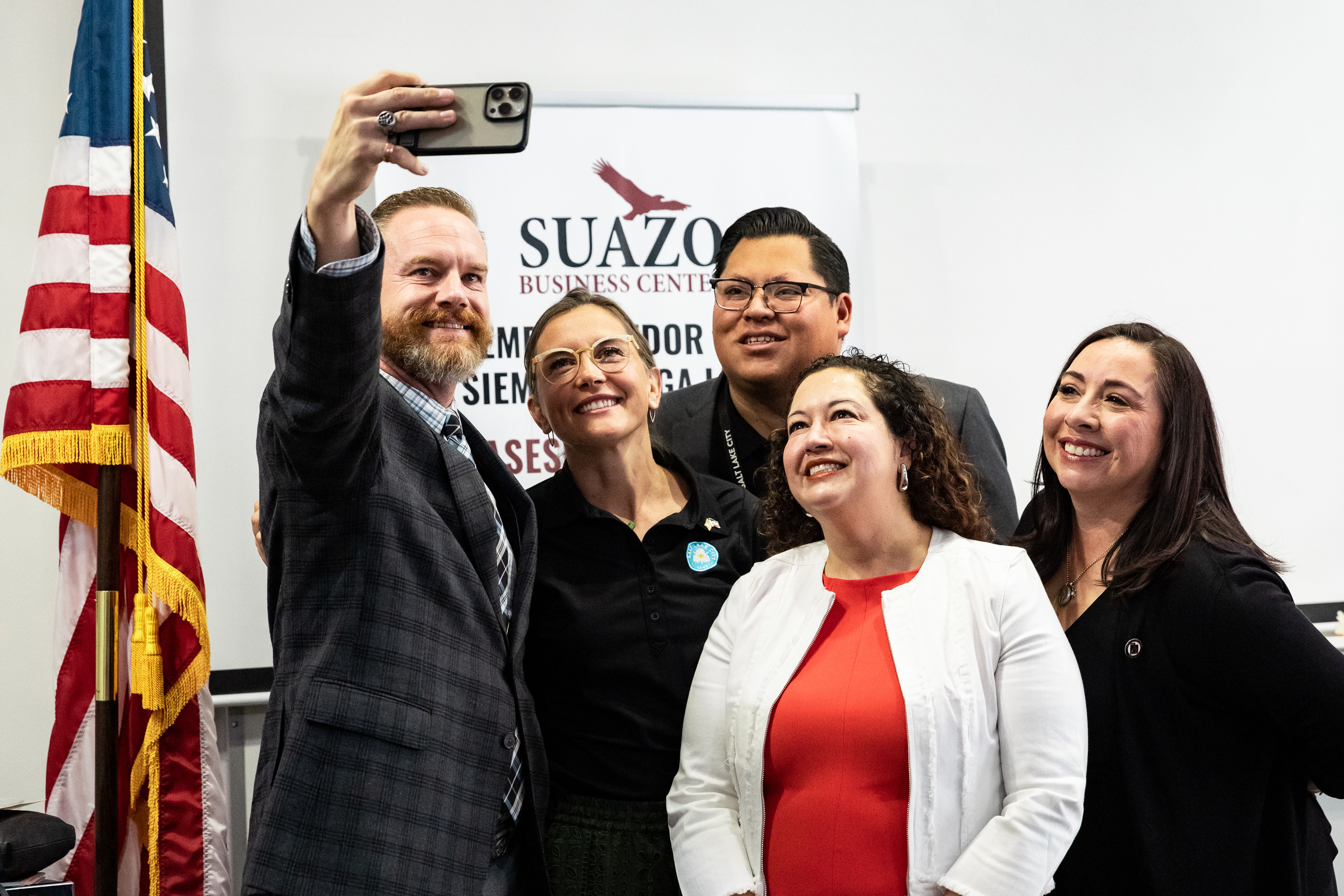 Salt Lake City Mayor Erin Mendenhall and representatives of Salt Lake’s Hispanic community take a selfie at the Suazo Business Center in Salt Lake City on Friday.