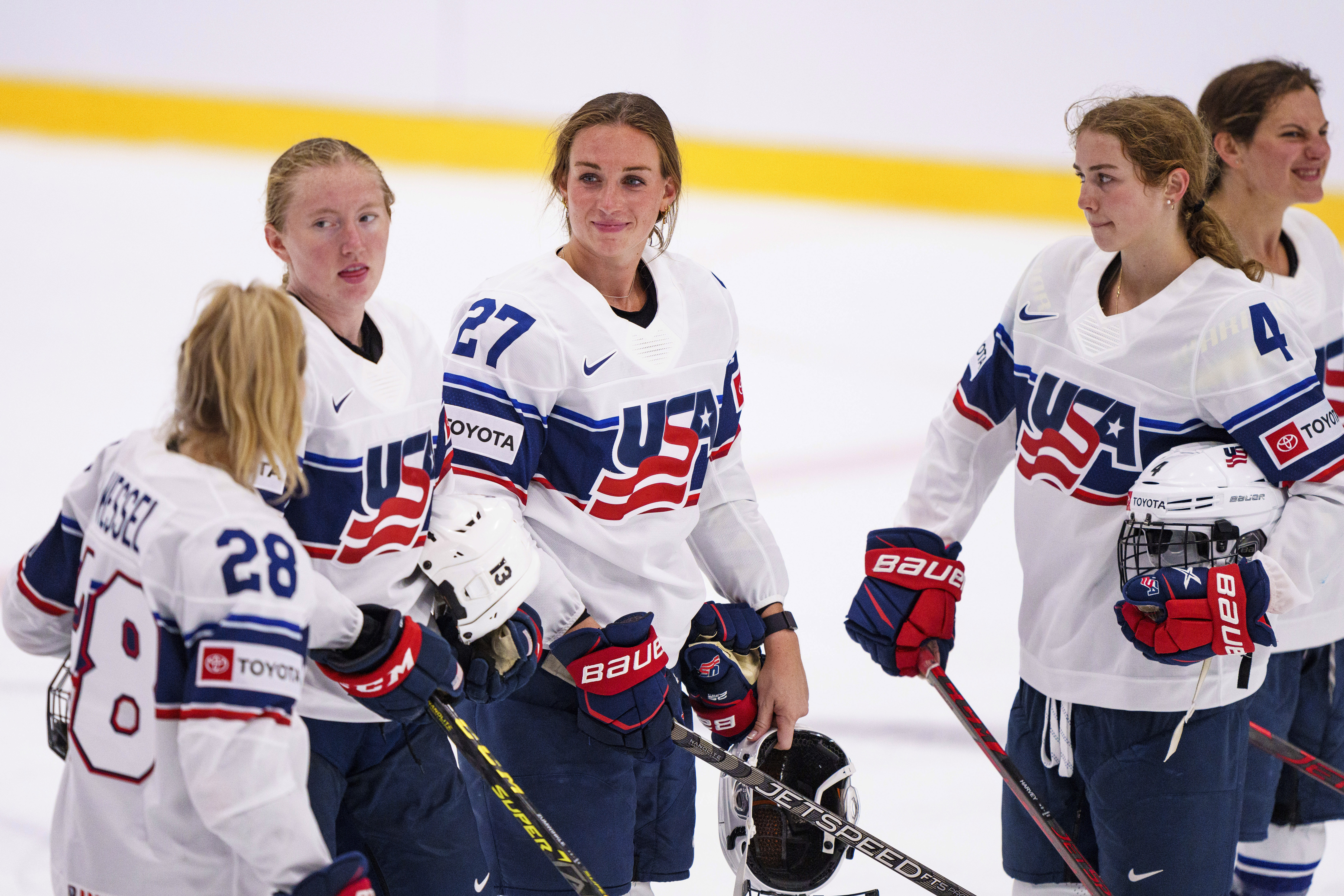 FILE - Team USA Taylor Heise (27) with teammates after the IIHF World Championship Women's ice hockey match against Japan in Herning, Denmark, Thursday, Aug. 25, 2022. The newly launched Professional Women's Hockey League is taking shape. Each of the six franchise's head coaches are expected to be announced on Friday, Sept. 15. And Minnesota is looking ahead to the league's inaugural draft on Monday, when the yet-to-be-named franchise is expected to select Taylor Heise with the No. 1 pick. 