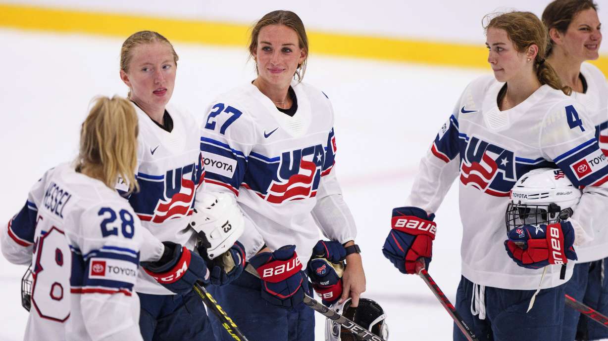 FILE - Team USA Taylor Heise (27) with teammates after the IIHF World Championship Women's ice hockey match against Japan in Herning, Denmark, Thursday, Aug. 25, 2022. The newly launched Professional Women's Hockey League is taking shape. Each of the six franchise's head coaches are expected to be announced on Friday, Sept. 15. And Minnesota is looking ahead to the league's inaugural draft on Monday, when the yet-to-be-named franchise is expected to select Taylor Heise with the No. 1 pick.