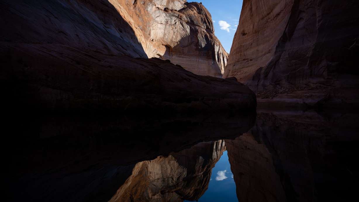 Light and shadows on the canyon walls of Davis Gulch, a side canyon on the Escalante River arm of Lake Powell, are reflected in the reservoir’s waters on Friday, Oct. 7, 2022. The company Storyboards relied on its experts to analyze the top 10 beautiful places in the United States that are picturesque favorites based on the number of Instagram hashtags.