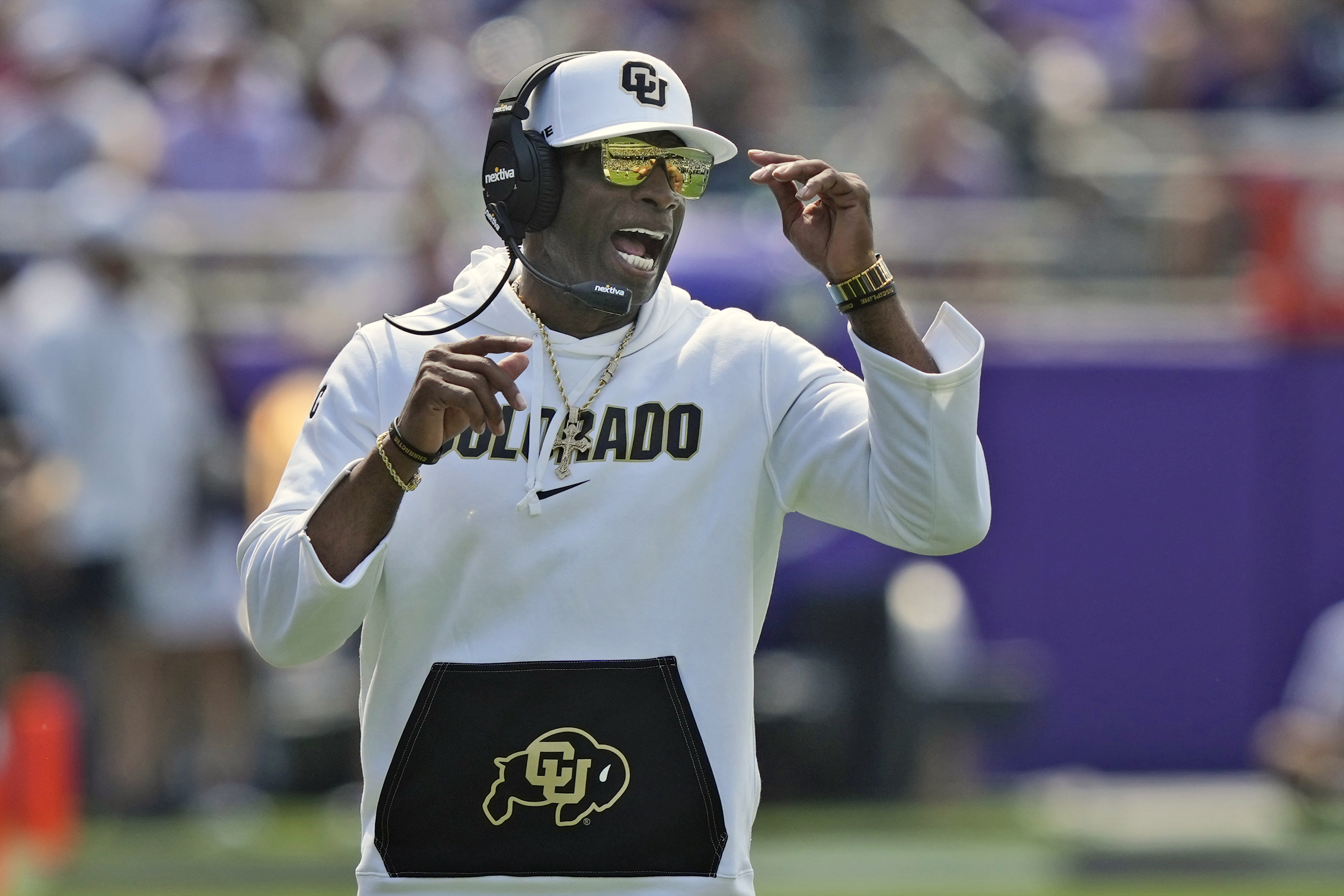 Colorado head coach Deion Sanders yells from the sidelines during the first half of an NCAA college football game against TCU Saturday, Sept. 2, 2023, in Fort Worth, Texas.