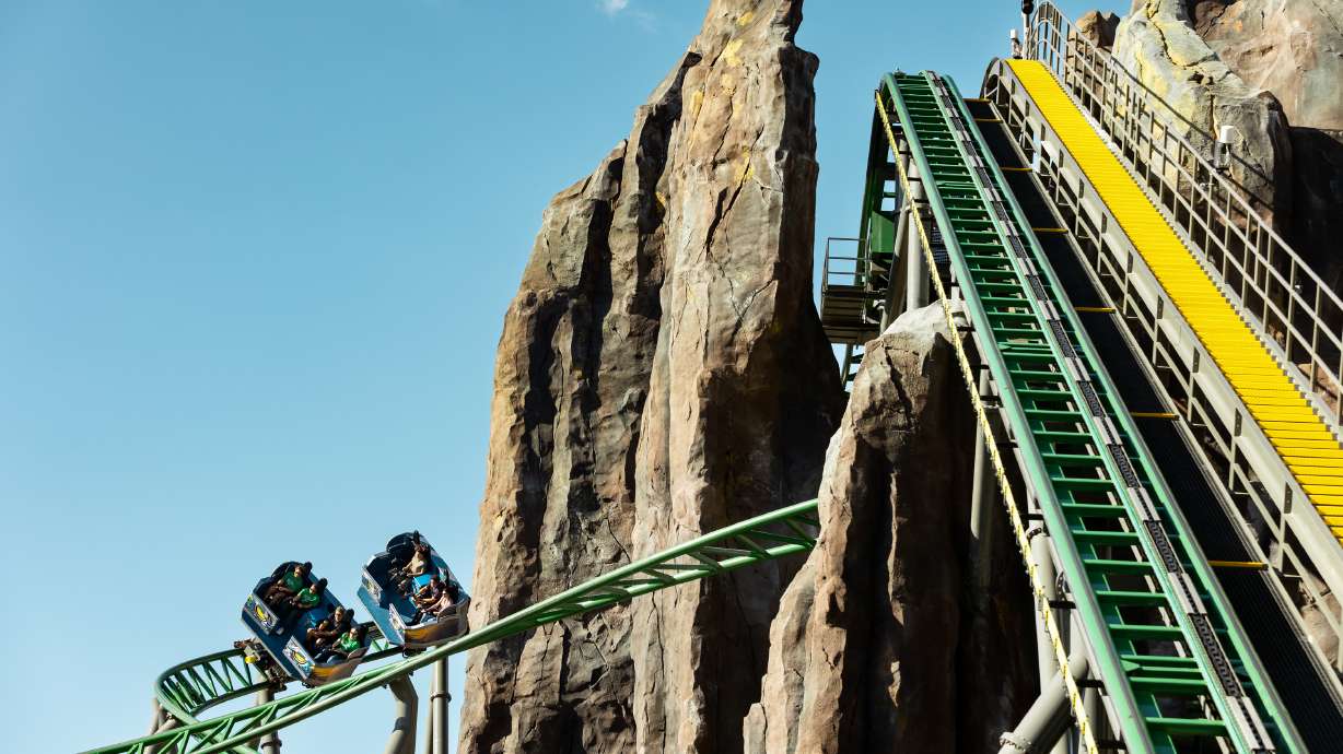 The first riders ride Lagoon’s new ride, Primordial, on its opening day at the amusement park in Farmington on Friday.