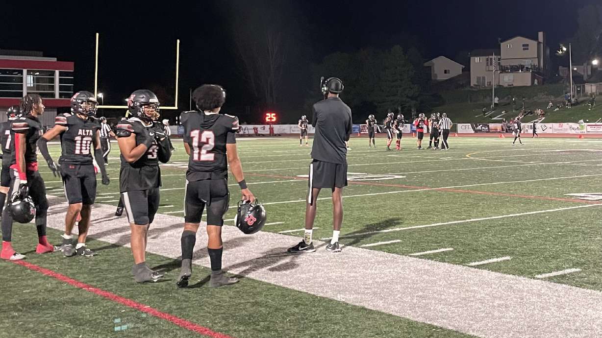Alta quarterback Kepa Niumeitolu looks out to the field during the Hawks' 34-14 win over Highland.