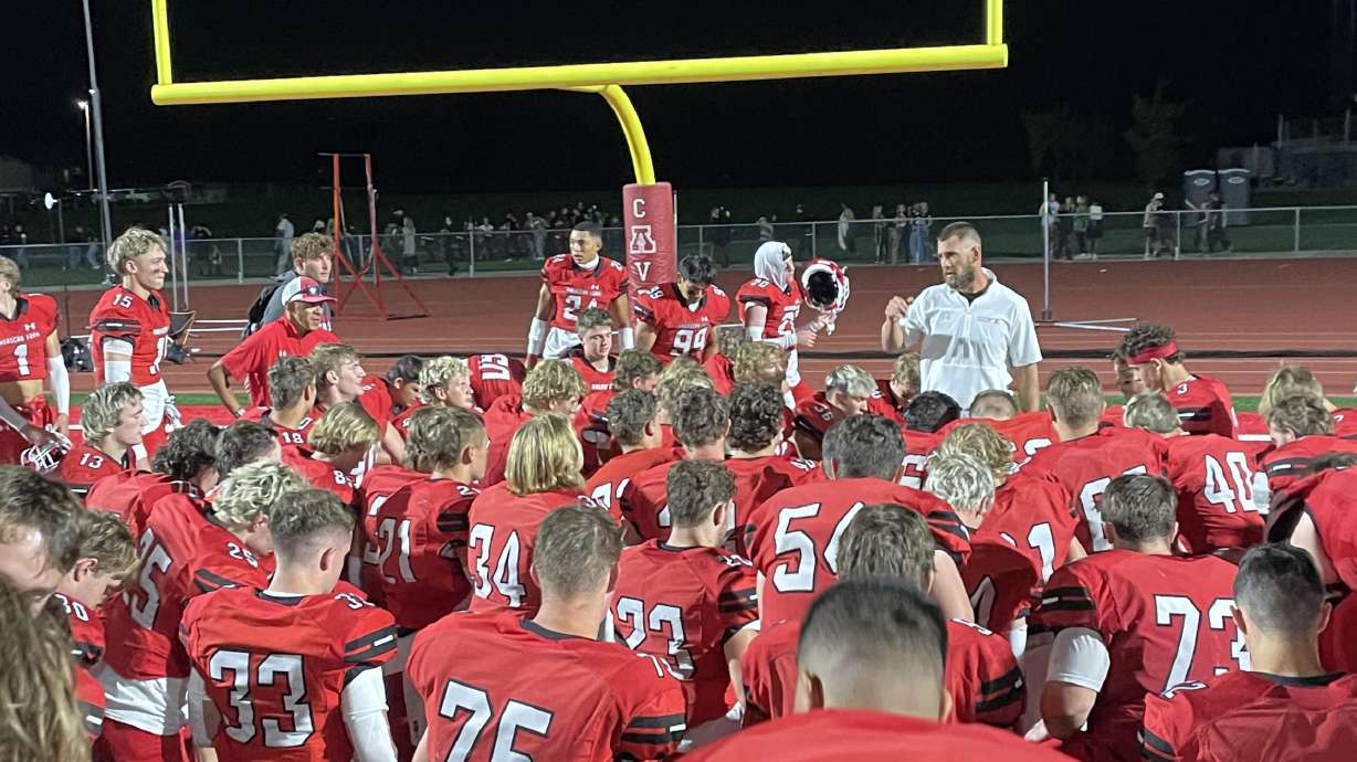 American Fork coaches talk to players after a 62-28 win over region rival Lehi.
