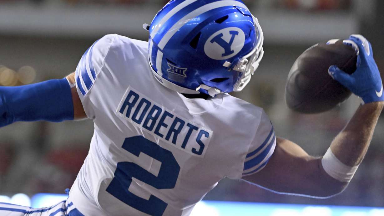 BYU wide receiver Chase Roberts pulls in a touchdown pass against Arkansas during the second half of an NCAA college football game Saturday, Sept. 16, 2023, in Fayetteville, Ark.