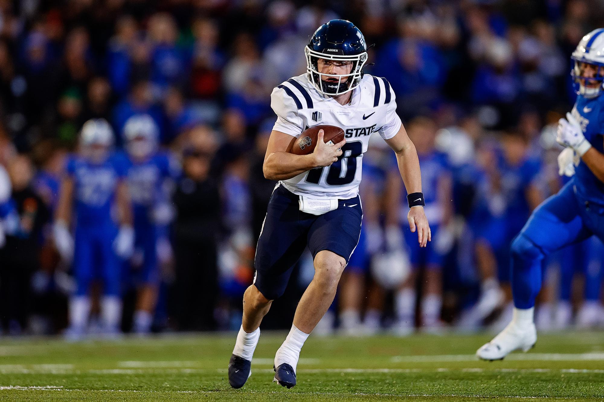 Utah State Aggies quarterback McCae Hillstead (10) runs the ball in the second quarter against the Air Force Falcons at Falcon Stadium.