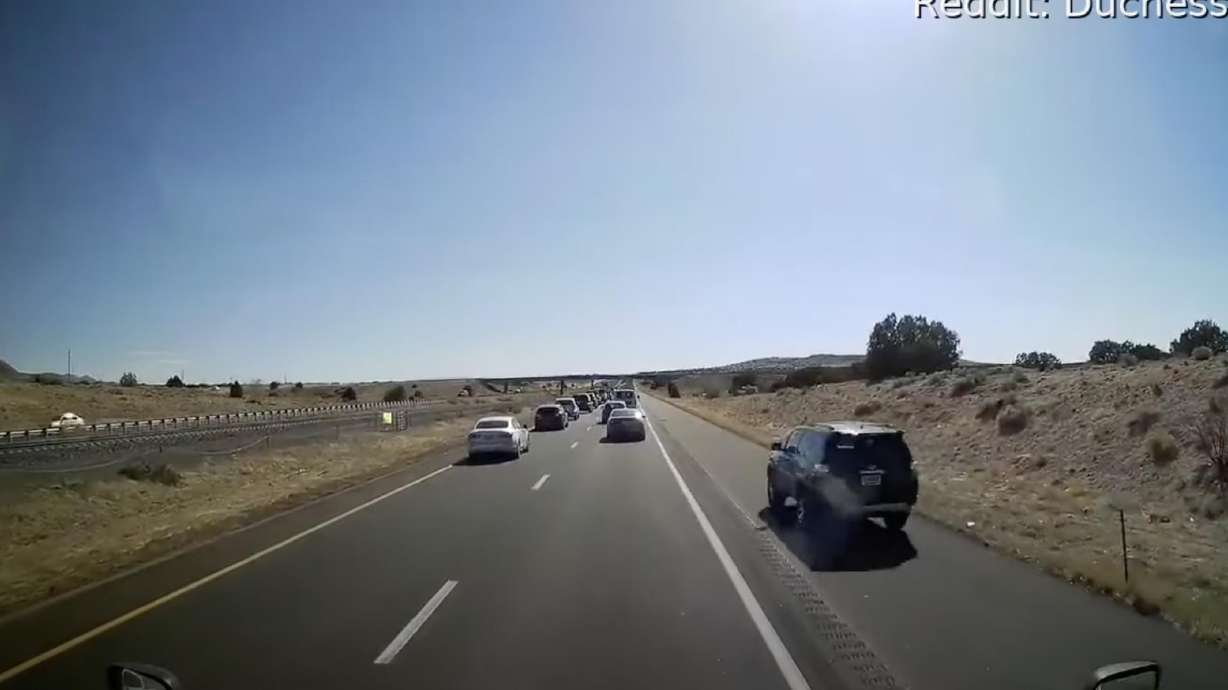 A vehicle passes on the shoulder and is seen shortly after seen stopped by police.