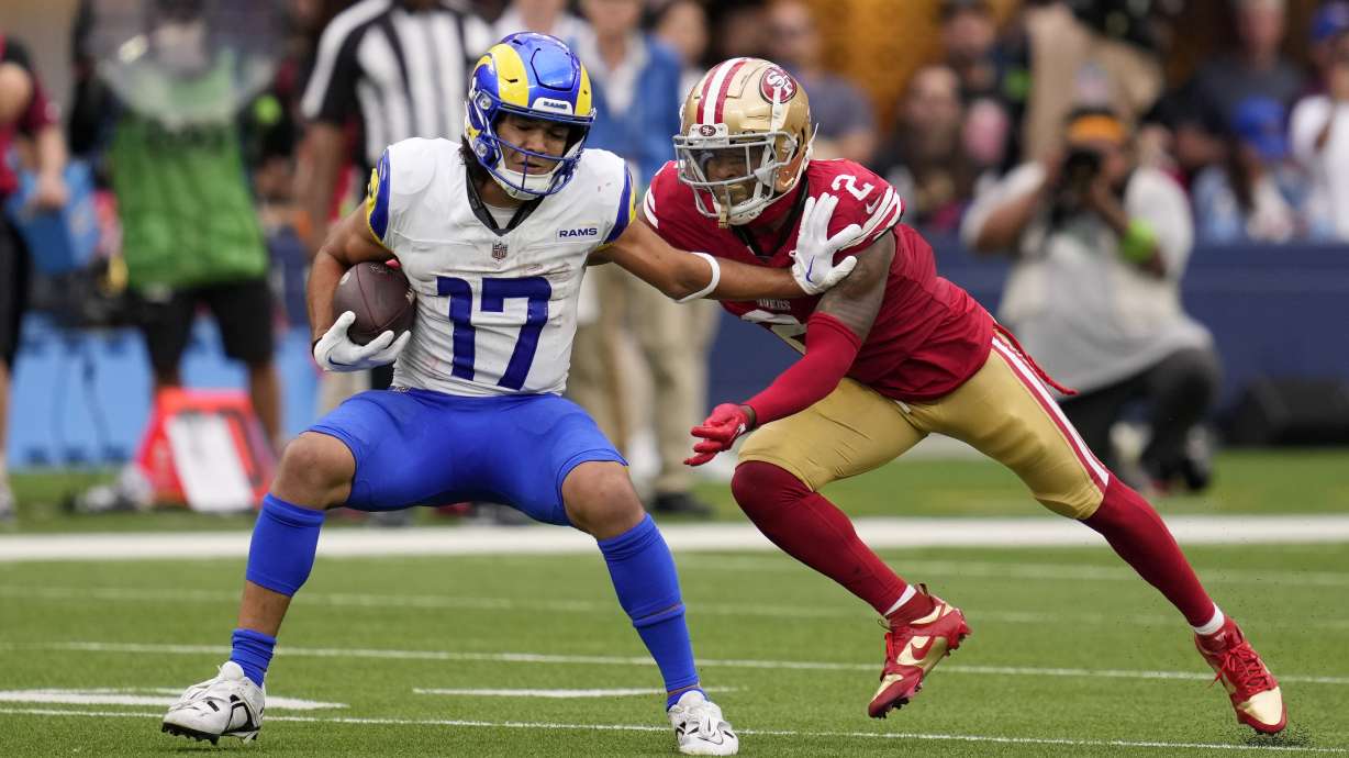 Los Angeles Rams wide receiver Puka Nacua, left, tries to fend off San Francisco 49ers cornerback Deommodore Lenoir during the second half of an NFL football game Sunday, Sept. 17, 2023, in Inglewood, Calif.