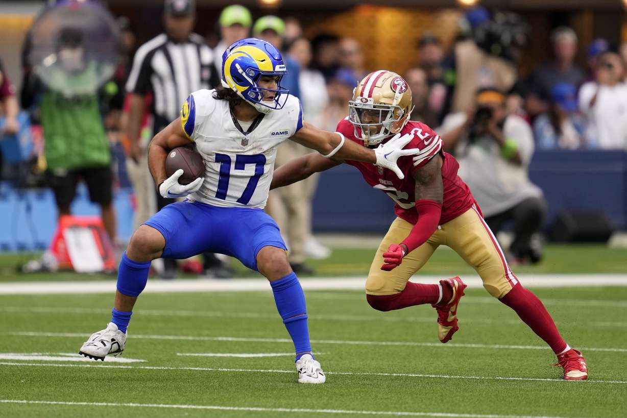 Los Angeles Rams wide receiver Puka Nacua, left, tries to fend off San Francisco 49ers cornerback Deommodore Lenoir during the second half of an NFL football game Sunday, Sept. 17, 2023, in Inglewood, Calif.