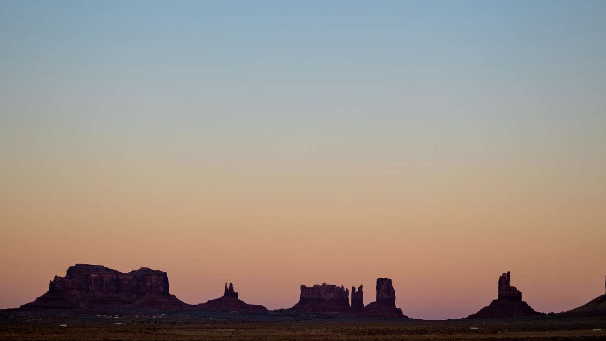 Monument Valley, which straddles the Utah-Arizona border on the Navajo Nation, at dusk on Nov. 16, 2022. The valley will be closed during the upcoming eclipse.