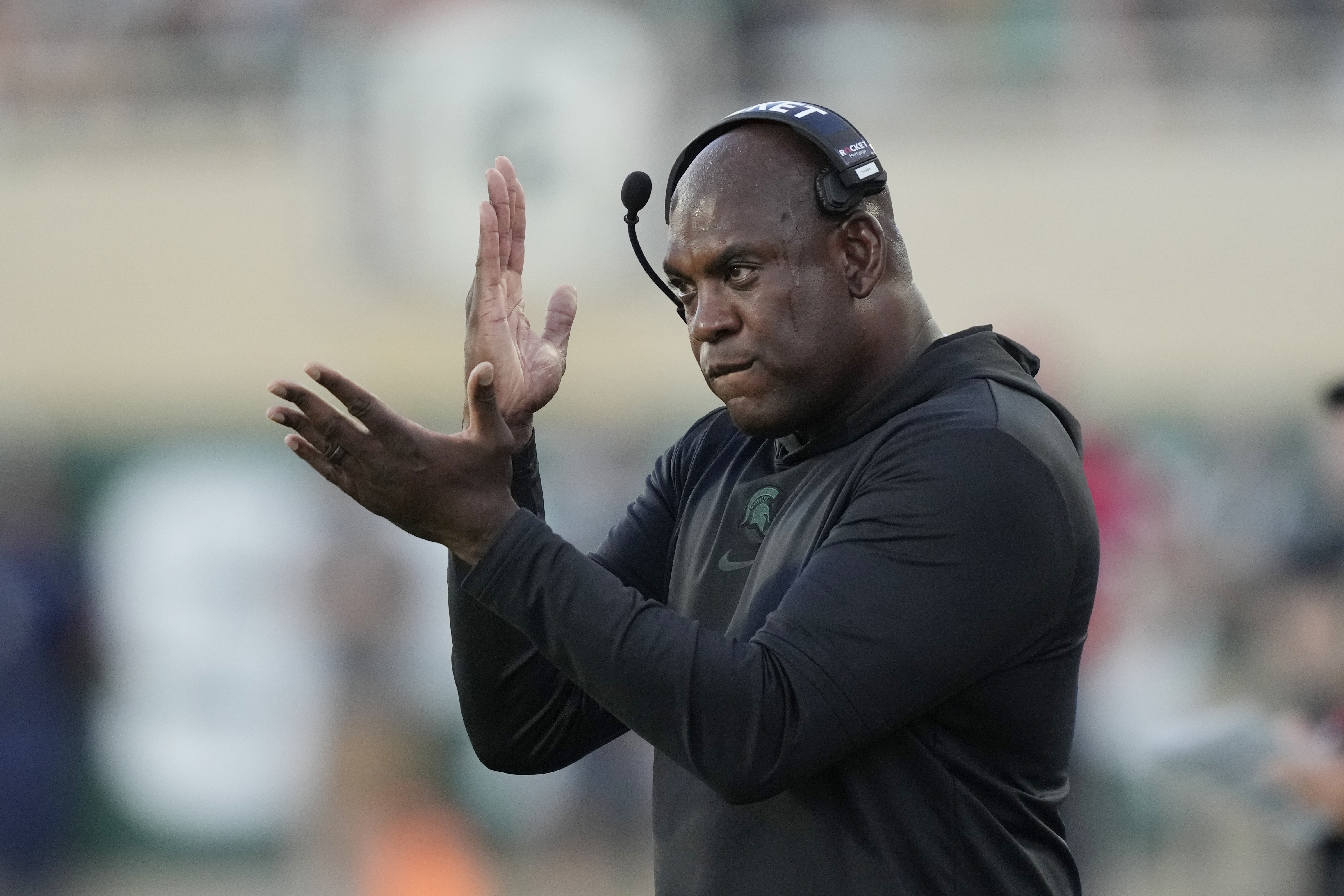 Michigan State head coach Mel Tucker signals from the sideline during the first half of an NCAA college football game against Central Michigan, Friday, Sept. 1, 2023, in East Lansing, Mich. 