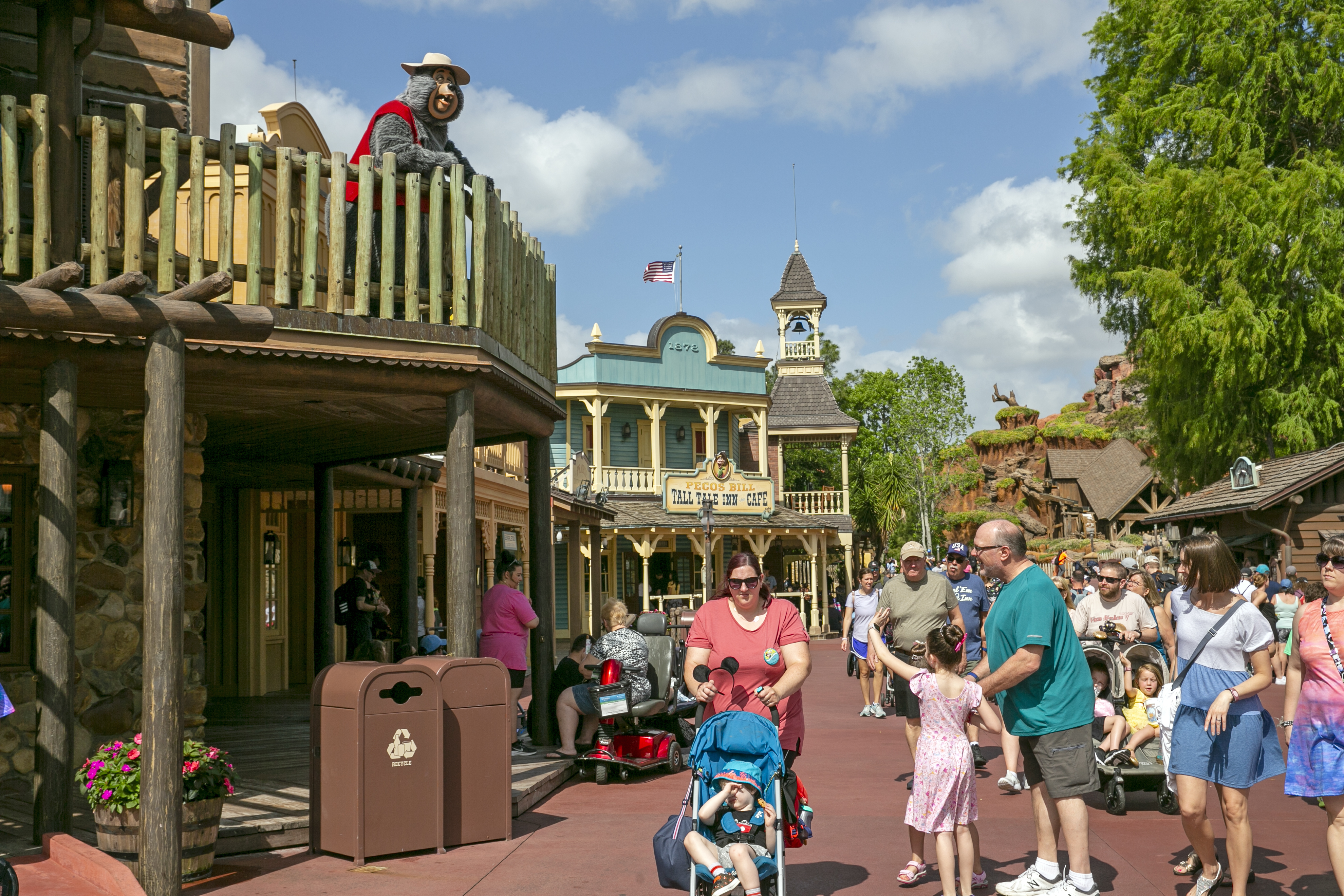 A performer dressed as a bear from the Country Bear Jamboree show entertains visitors from a deck at Magic Kingdom Park at Walt Disney World Resort in Lake Buena Vista, Fla., on April 22, 2022. It wasn't an escapee from the Country Bear Jamboree attraction, but a wild black bear managed to be the star of its own show Monday.