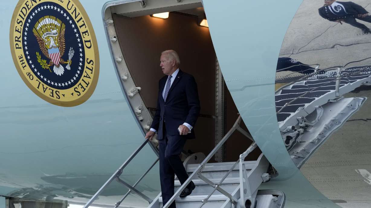 President Joe Biden walks down the steps of Air Force One at John F. Kennedy International Airport in New York, Sunday. Biden is in New York to attend the United Nations General Assembly and fundraisers.