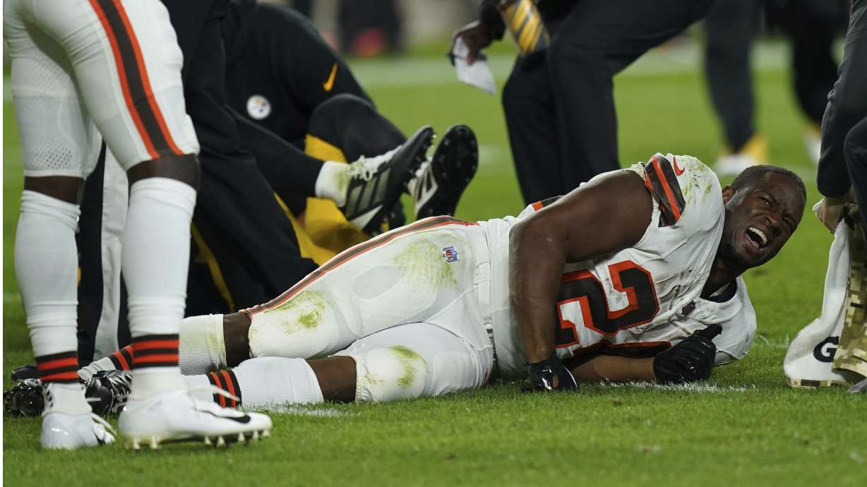 Cleveland Browns running back Nick Chubb, grimaces on the field after an injury during the first half of an NFL football game against the Pittsburgh Steelers Monday, Sept. 18, 2023, in Pittsburgh.