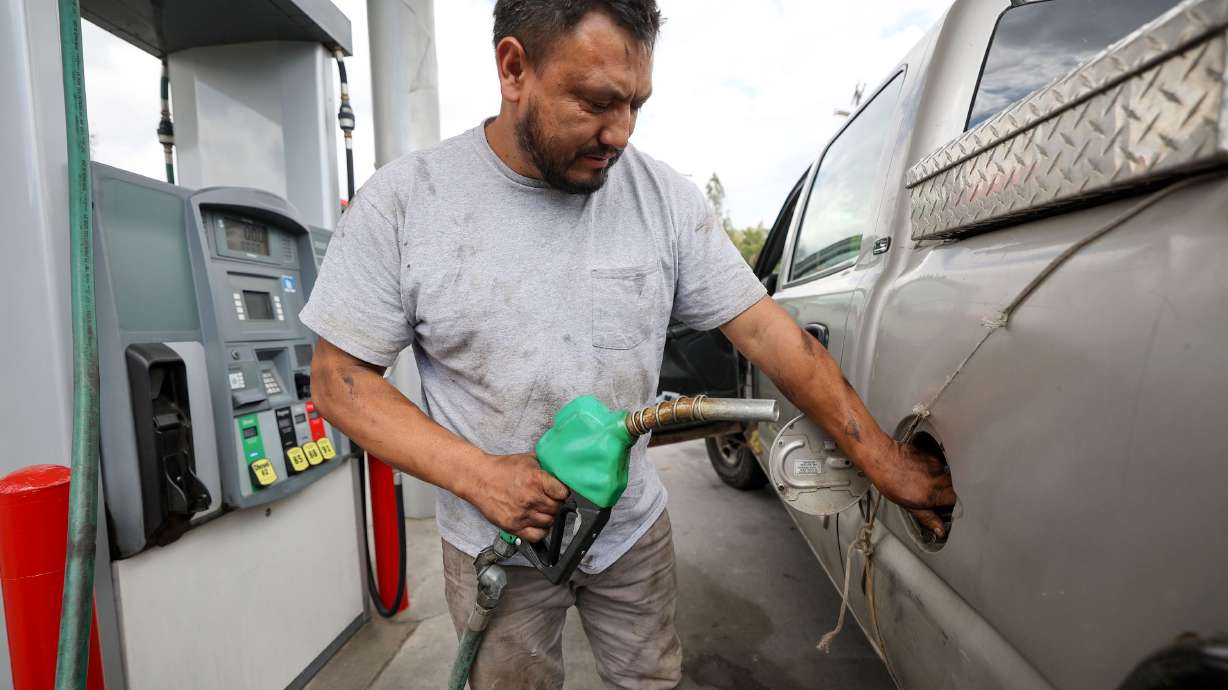 Gerardo Aguilar gets diesel gas at Shoppers Express in Salt Lake City Wednesday. Utah is among the most expensive states to buy gas, even as summer driving season comes to a close and demand softens.