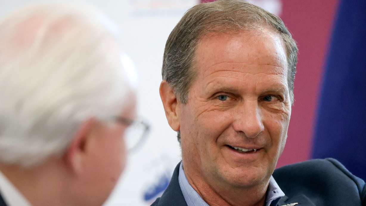 Rep. Chris Stewart, R-Utah, right, speaks with Rick Larsen in Salt Lake City on Aug. 3. Stewart announced Tuesday, following his retirement from Congress last week, that he will serve as the managing partner of a new government affairs firm.