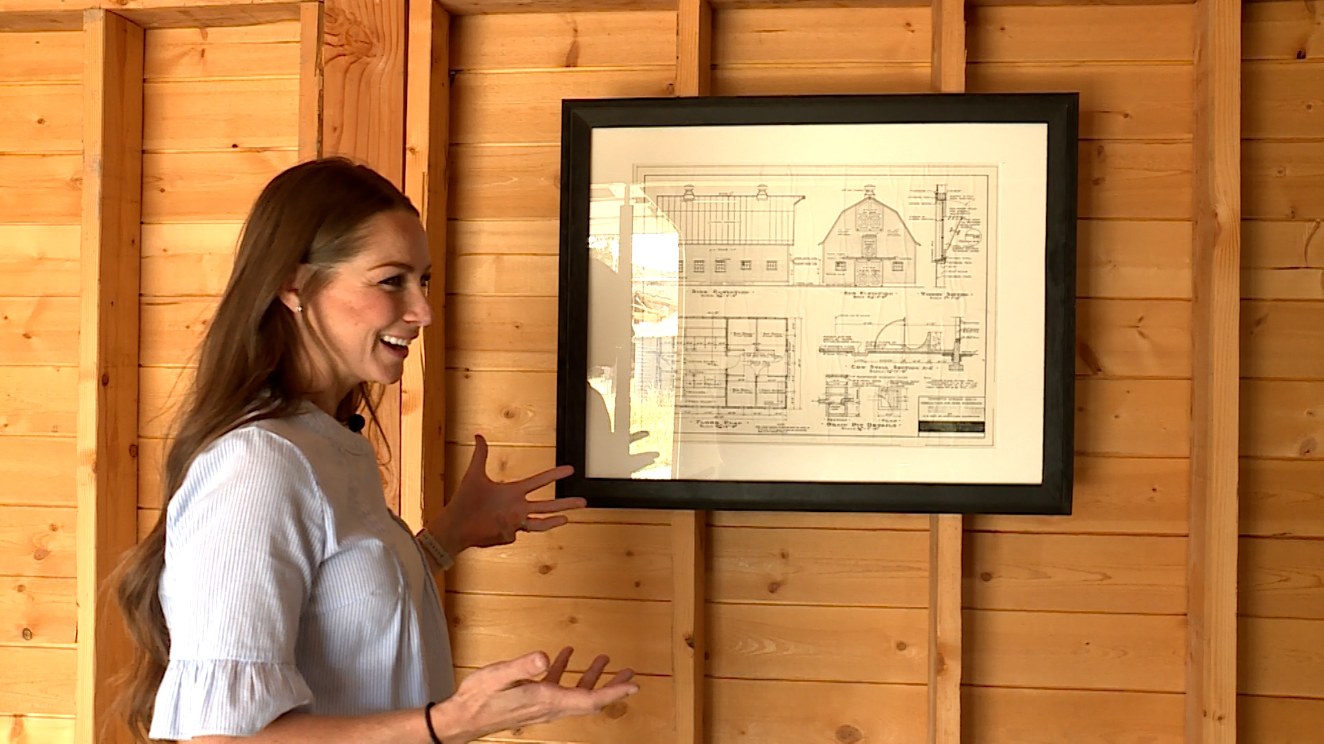 Kelli Snider showing off the floor plans of the barn used in weddings in Cache County, Tuesday. Barn weddings have become quite the thing in Utah in the past few years.