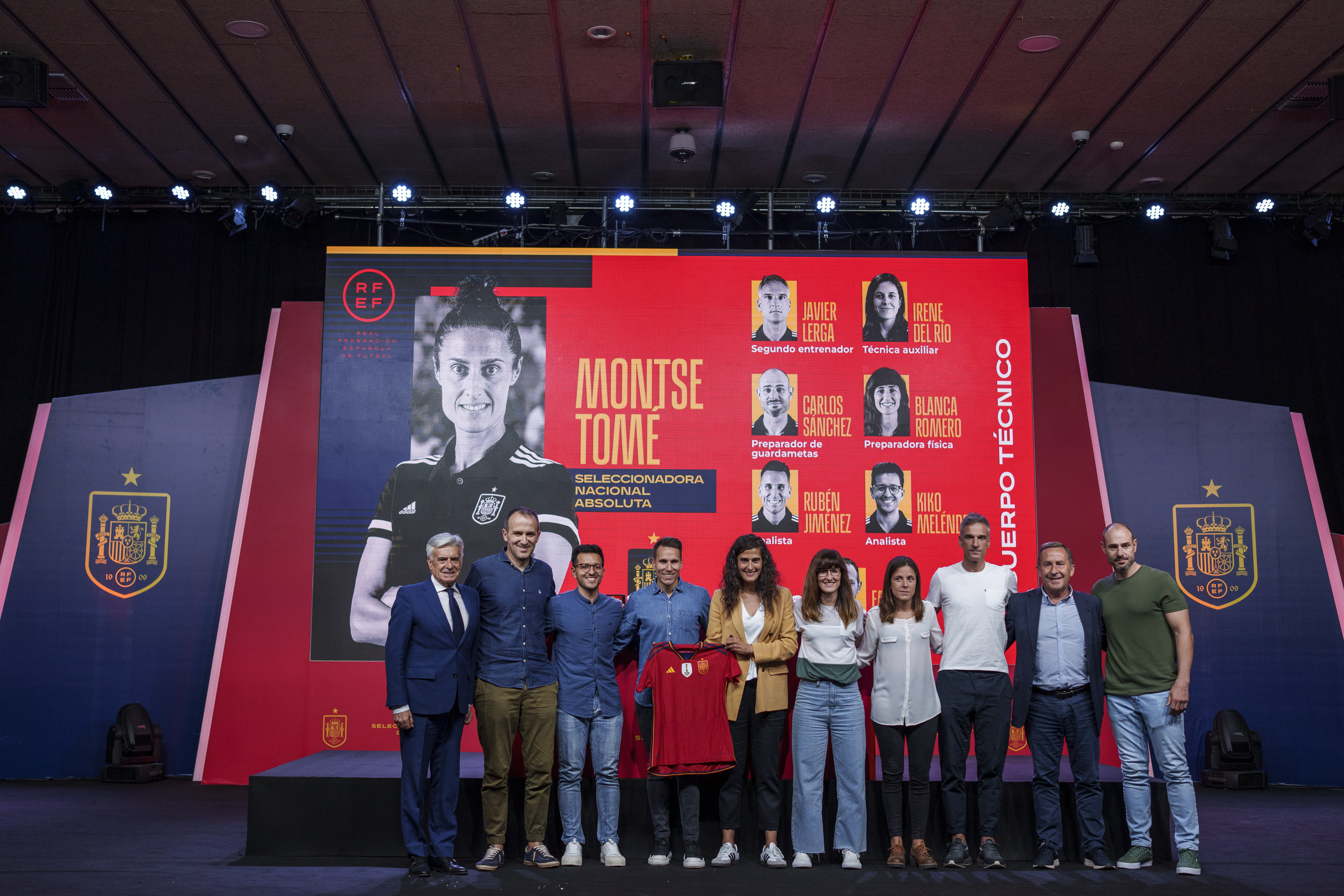 Spain's new women's national team coach Montse Tome, center, holds a jersey during her official presentation with her technical staff at the Spanish soccer federation headquarters in Las Rozas, just outside of Madrid, Spain, Monday, Sept. 18, 2023. Tome replaced Jorge Vilda less than three weeks after Spain won the Women's World Cup title and amid the controversy involving suspended federation president Luis Rubiales who has now resigned. 