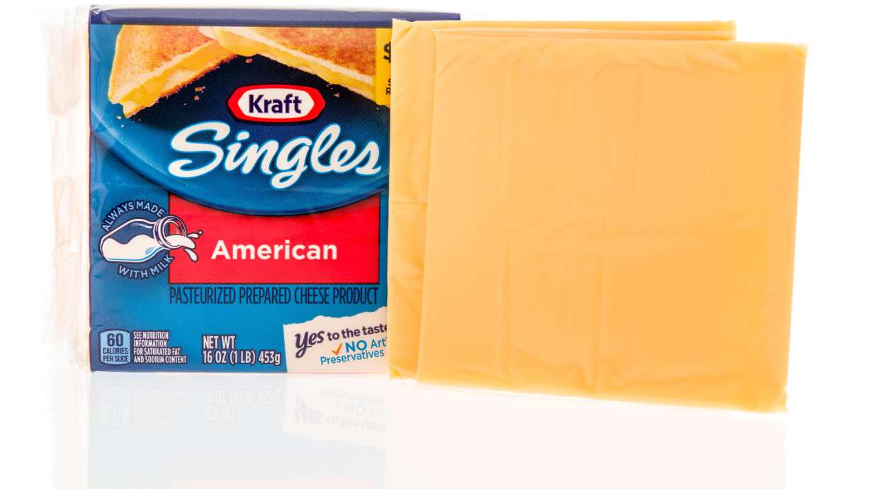 Kraft Heinz is recalling more than 83,000 cases of individually-wrapped Kraft Singles American processed cheese slices because part of the wrapper could stick to the slice and become a choking hazard.