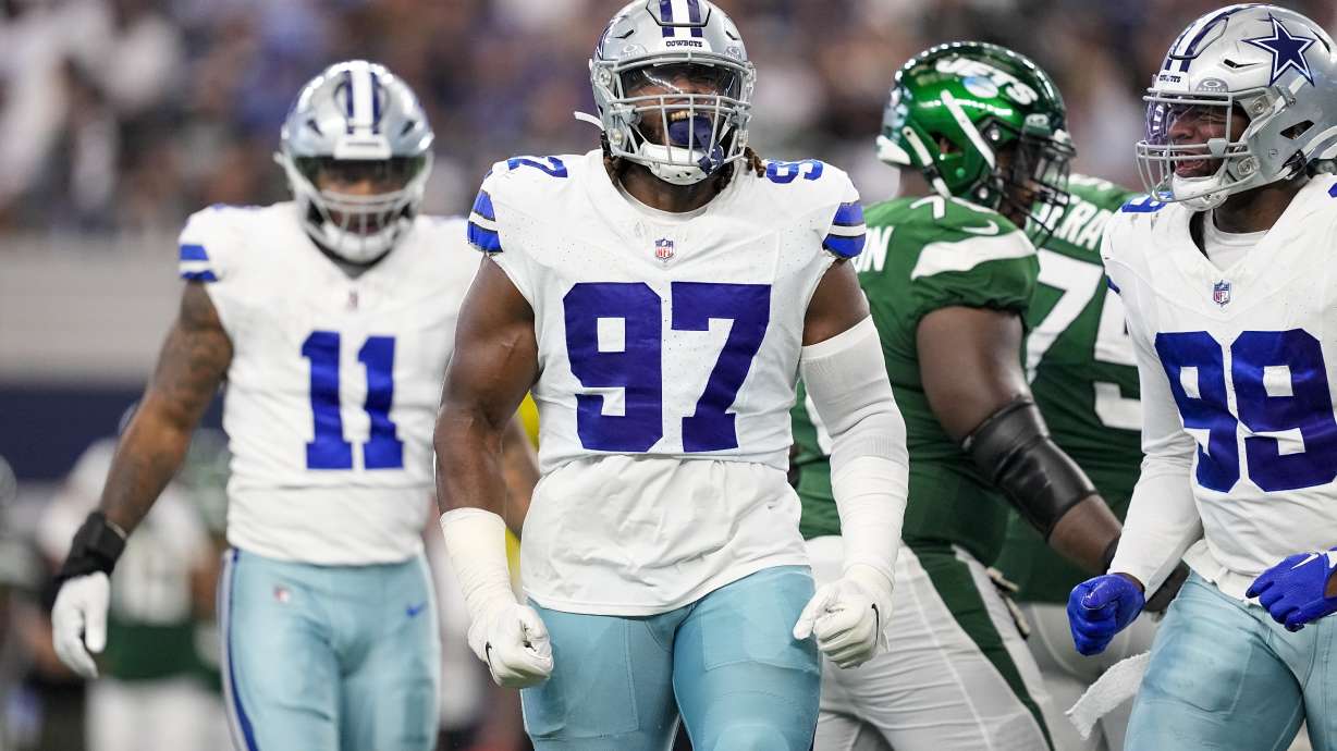 Dallas Cowboys defensive tackle Osa Odighizuwa celebrates after a sack against the New York Jets during the second half of an NFL football game in Arlington, Texas, Sunday, Aug. 17, 2023.