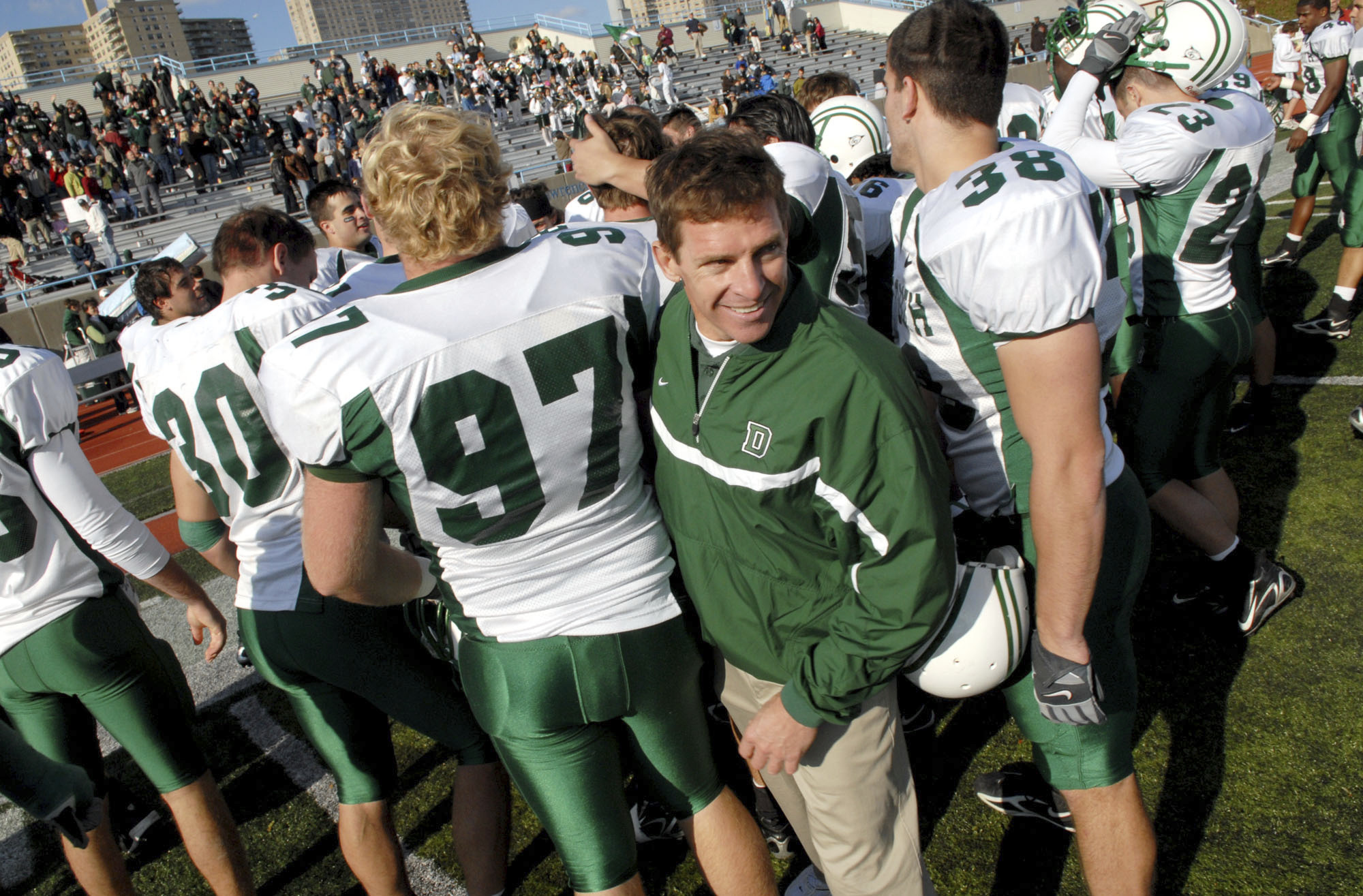 FILE - Dartmouth coach Buddy Teevens celebrates with the team after a win over Columbia during college football game Oct. 21, 2006, in New York. Teevens, the innovative Ivy League football coach who brought robotic tackling dummies to Dartmouth practices, died Tuesday, Sept. 19, 2023, of injuries he sustained from a bicycle accident in March. He was 66. School president Sian Leah Beilock and athletic director Mike Harrity announced Teevens' death in a letter to the Dartmouth community. 