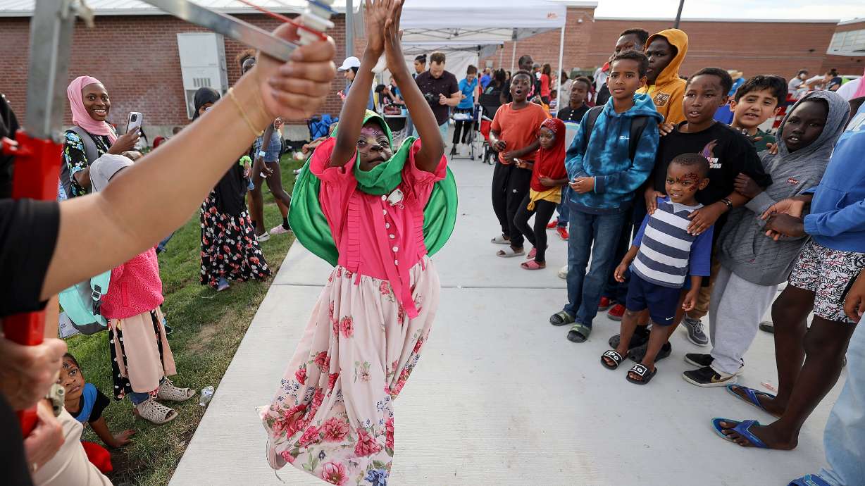 Marwa Ali, 5, tests how high she can jump during Refugee Back to School Night at Granite Park Junior High in South Salt Lake on Aug. 7. Data shows Utah accepts its fair share — and perhaps a bit more — of the nation's refugees.