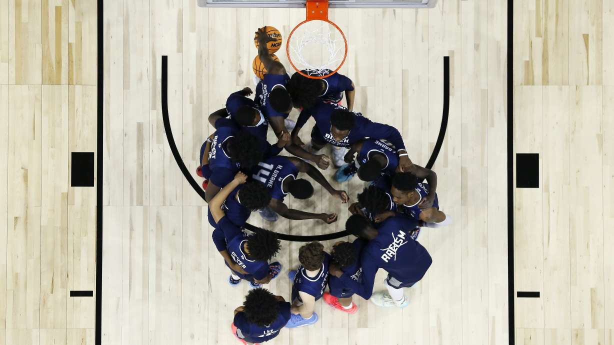 FILE - Saint Peter's players huddle before the second half of a college basketball game against Purdue in the Sweet 16 round of the NCAA tournament, Friday, March 25, 2022, in Philadelphia. The online sports betting company PointsBet committed three different types of violations of New Jersey sports betting laws, including taking bets on soccer games that had already ended, according to gambling regulators who fined the company $25,000. PointsBet accepted bets on March 25, 2022 on the St. Peter's men's basketball team, but which was ineligible to be bet on in New Jersey. The market for St. Peter's bets was live for 55 minutes and two people placed bets, totaling $60. Both were canceled.