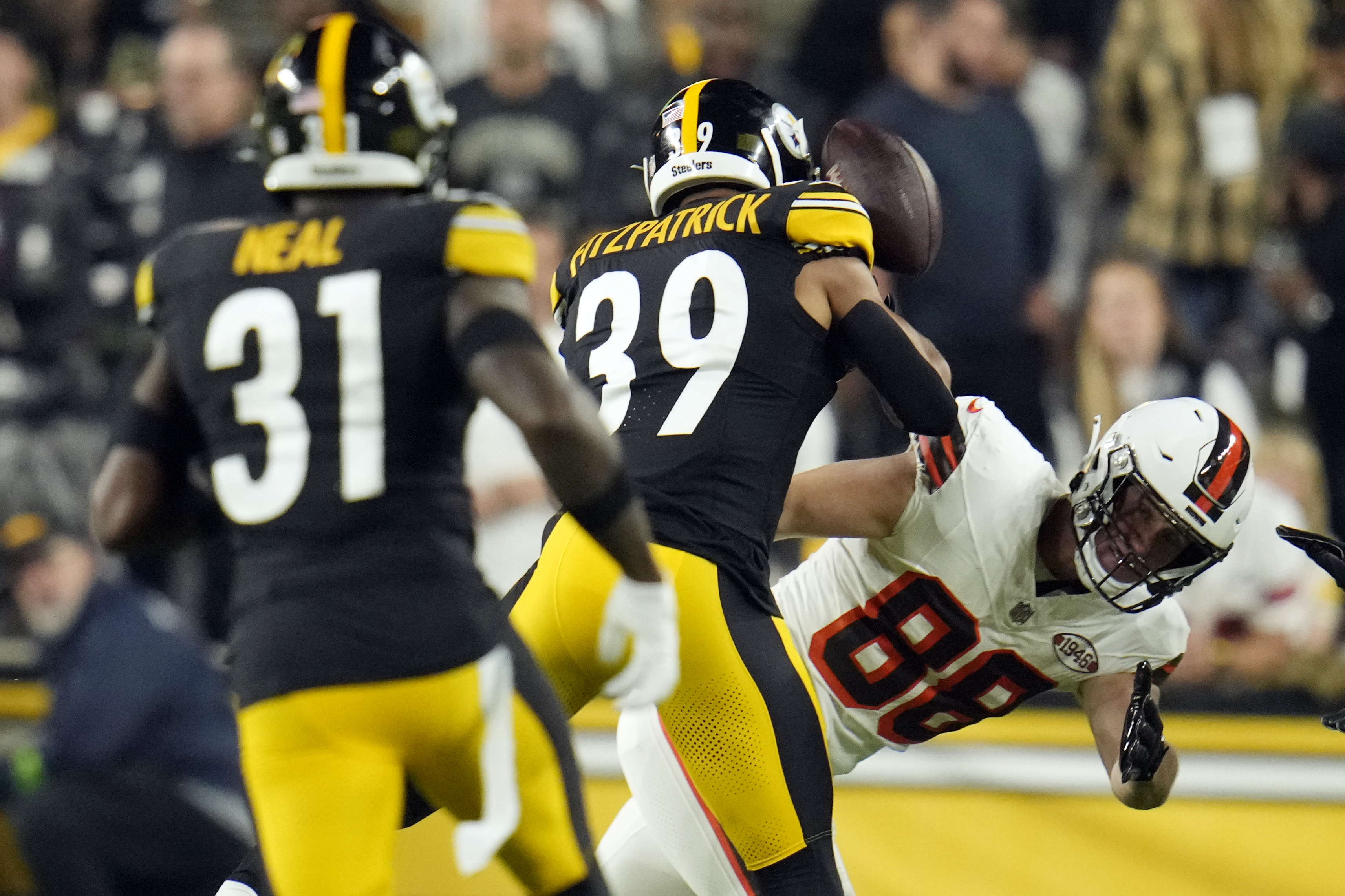 Cleveland Browns tight end Harrison Bryant (88) fumbles the football as he is hit by Pittsburgh Steelers safety Minkah Fitzpatrick (39) during the first half of an NFL football game Monday, Sept. 18, 2023, in Pittsburgh.