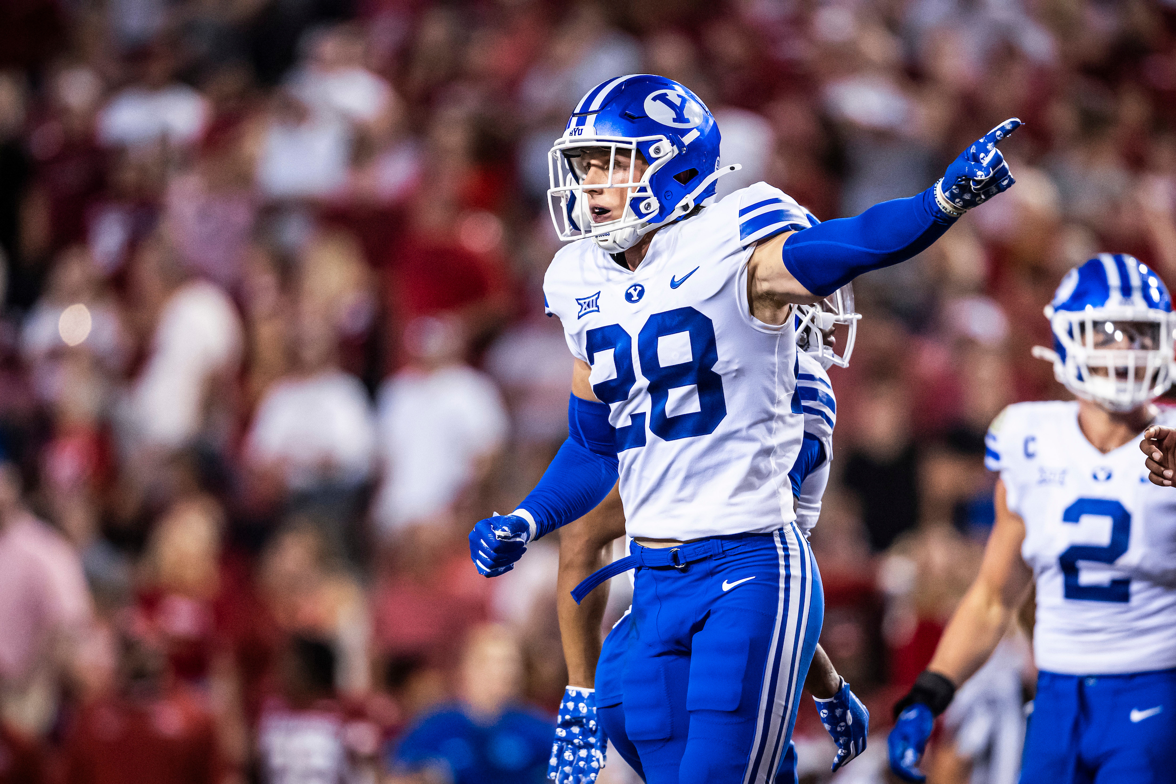 BYU safety Tanner Wall signals during the Cougars' 38-31 win over Arkansas, Saturday, Sept. 16, 2023, in Fayetteville, Arkansas.