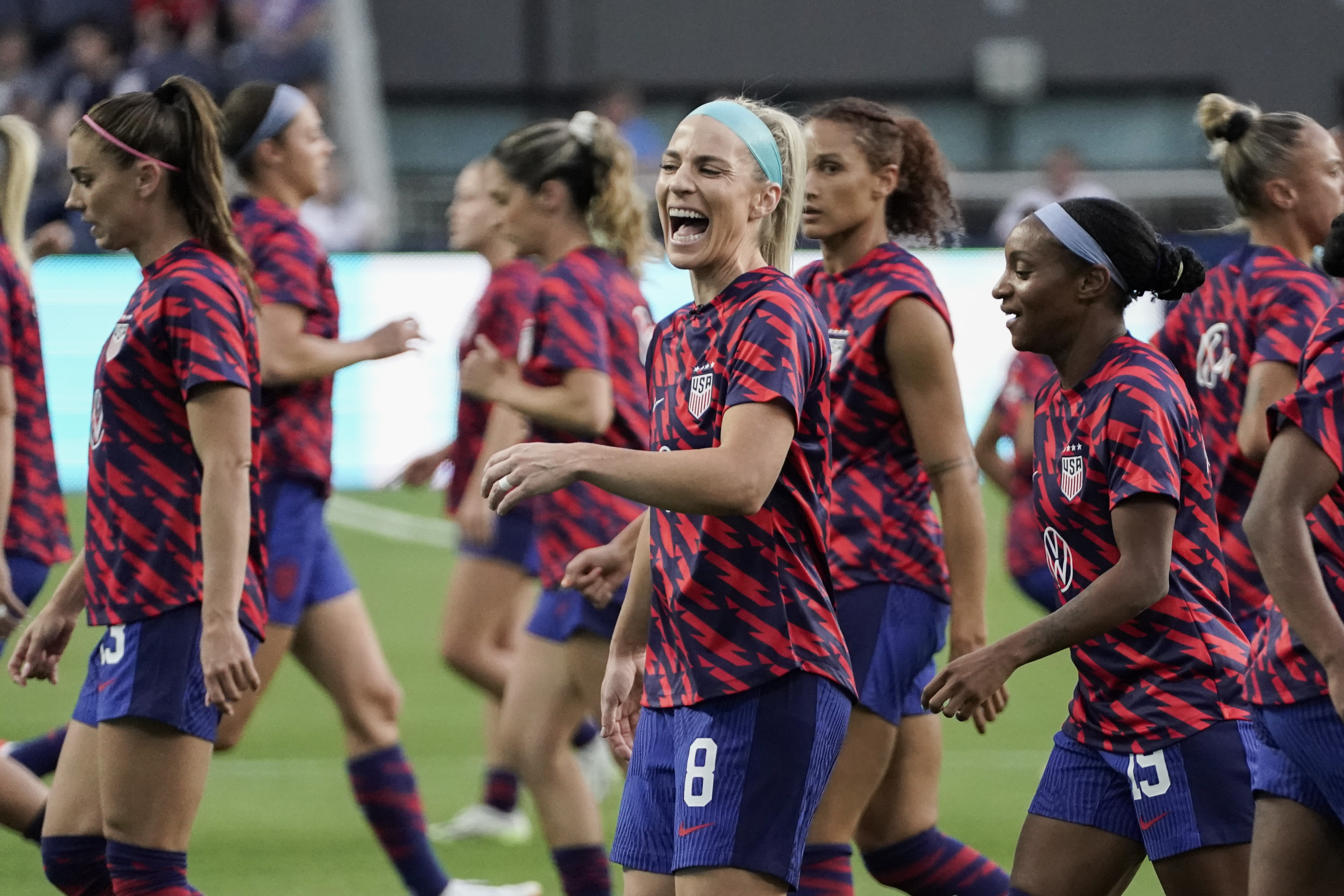 U.S. midfielder Julie Ertz, center, laughs while warming up with teammates before an international friendly soccer match against South Africa, Thursday, Sept. 21, 2023, in Cincinnati.