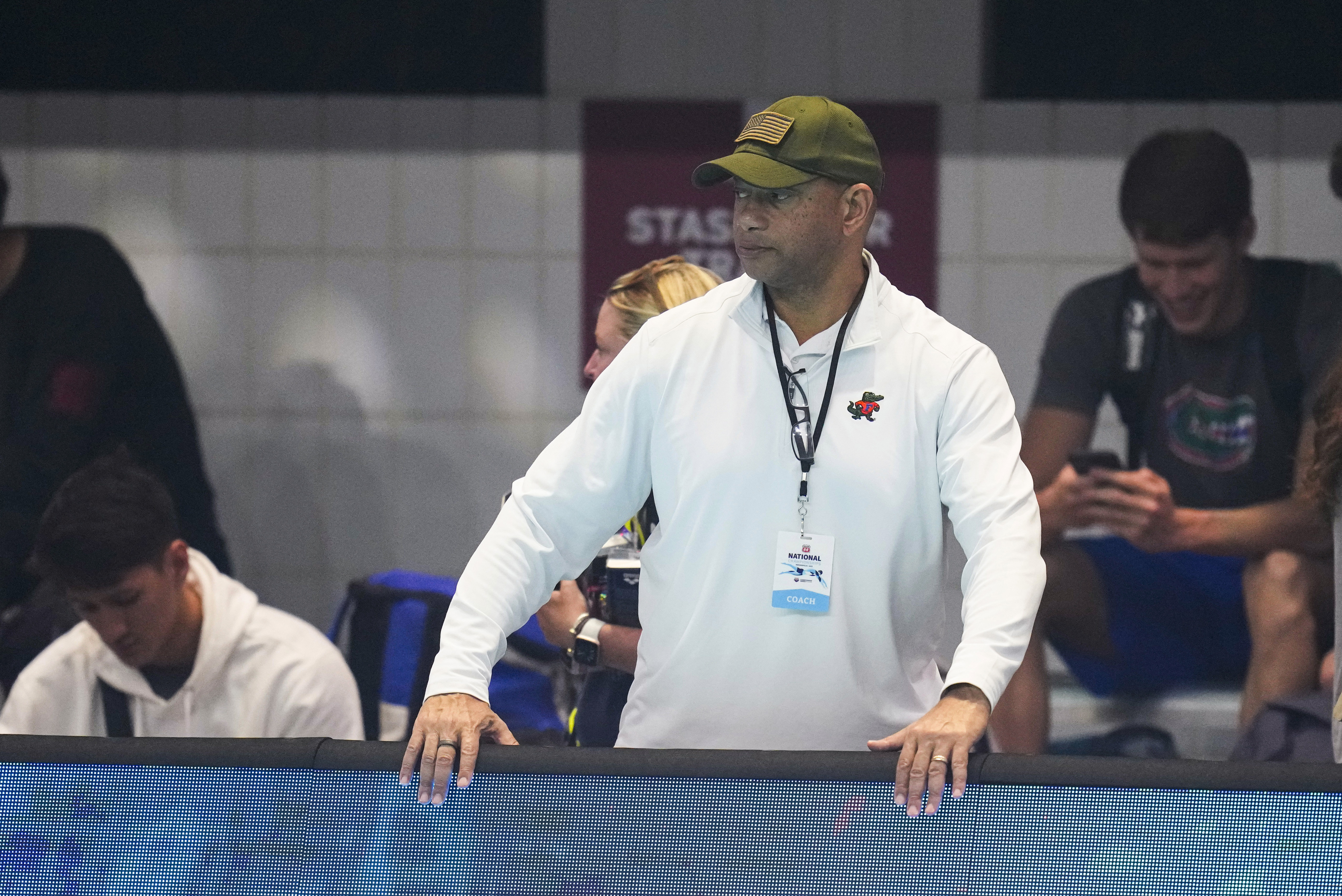 FILE - Coach Anthony Nesty watches as swimmers warm up at the U.S. nationals swimming meet in Indianapolis, June 27, 2023. Nesty made more history Thursday, Sept. 21, when he was picked to lead the U.S. men's swimming team in Paris, where he will become the first Black head coach for the powerhouse American squad at the Olympics. Nesty's selection was announced by USA Swimming, which also appointed Todd DeSorbo to head the women's squad next summer.