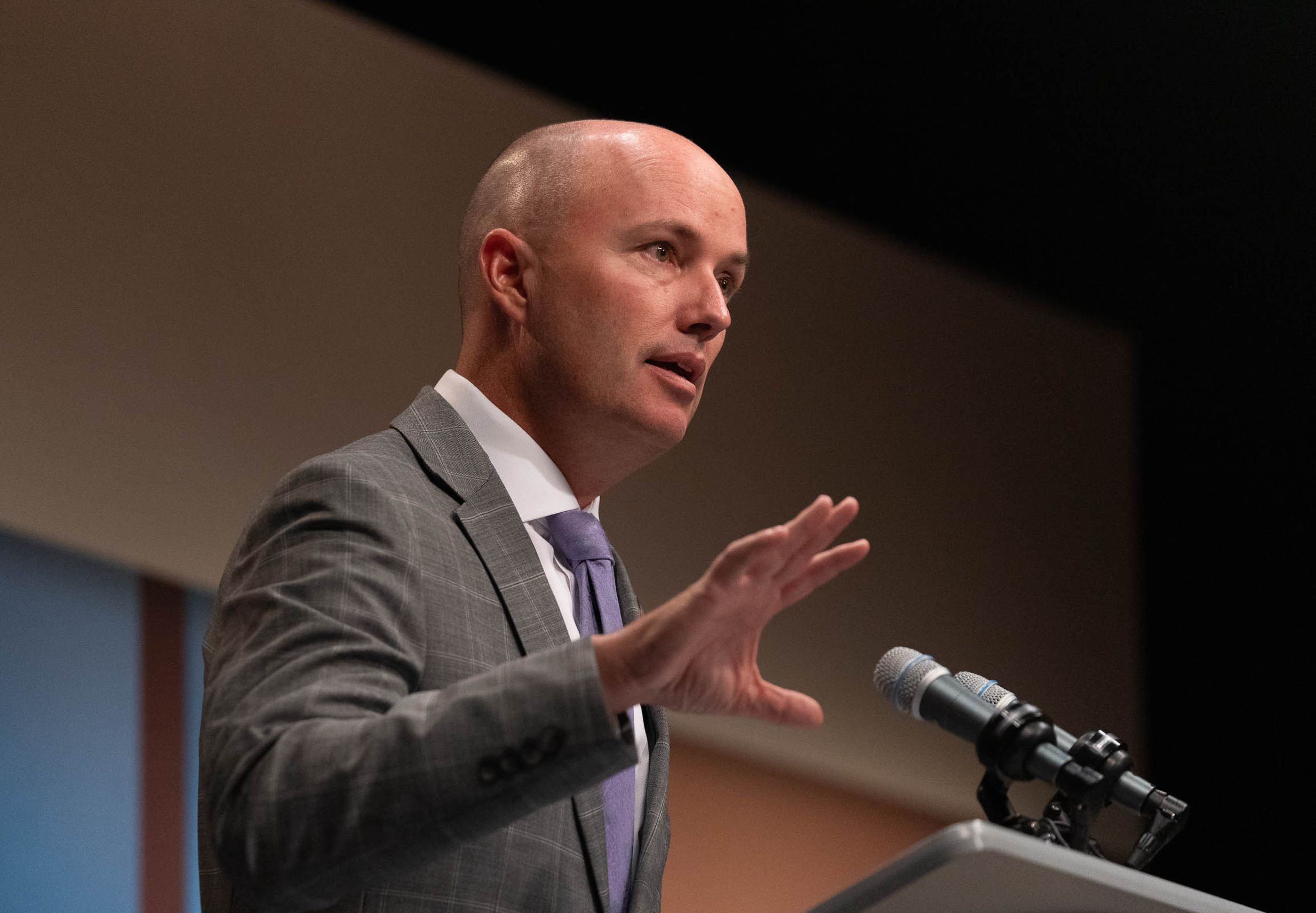 Gov. Spencer Cox speaks in Salt Lake City on Thursday. Sen. Mitt Romney and other elected officials are experiencing violent threats amid polarization. Utah Gov. Spencer Cox said it’s up to everyone — not just politicians — to stop it.