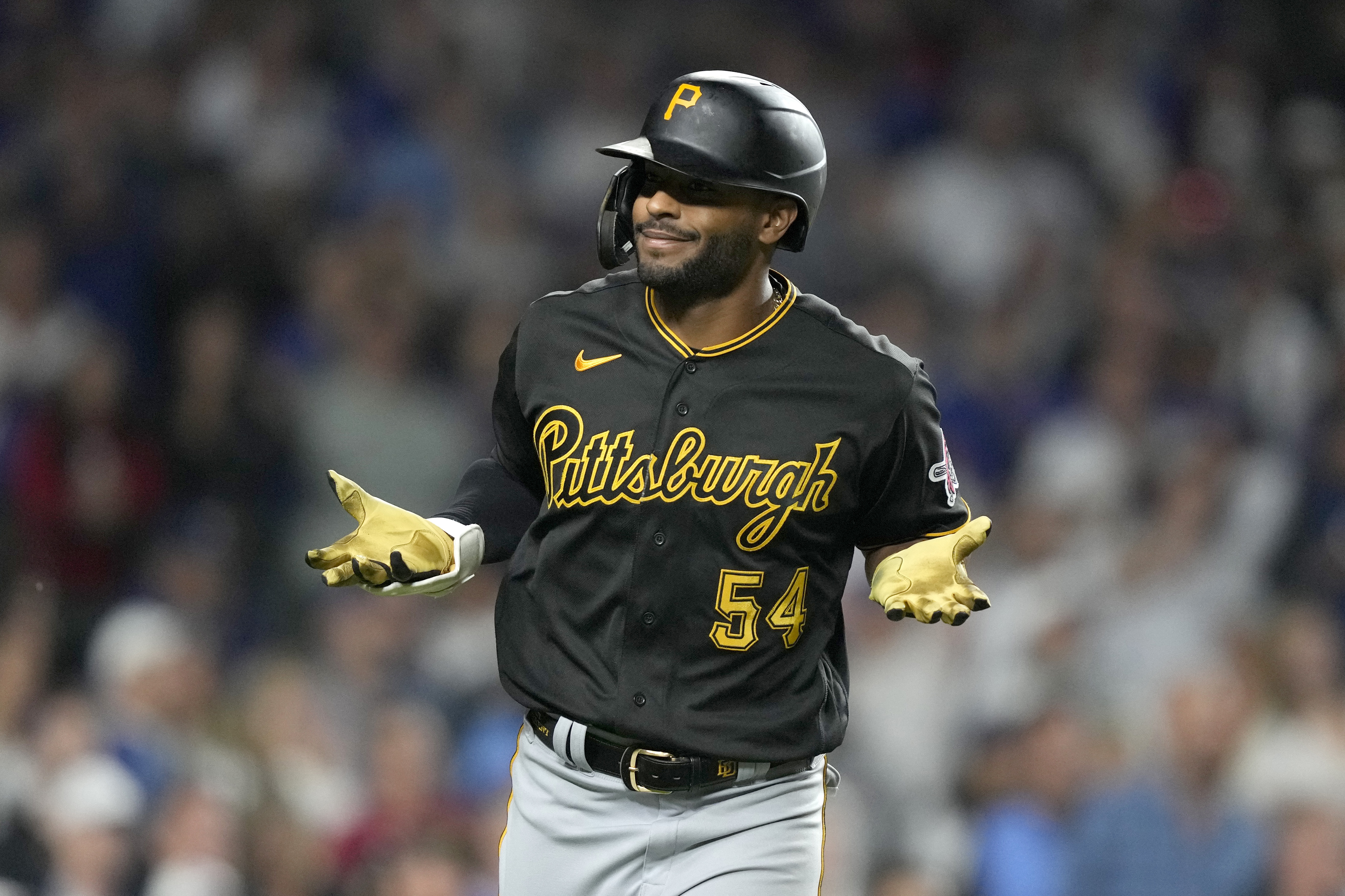 Pittsburgh Pirates' Joshua Palacios reacts toward teammates in the dugout after his pinch-hit, three-run home run off Chicago Cubs relief pitcher Julian Merryweather during the ninth inning of a baseball game Thursday, Sept. 21, 2023, in Chicago.