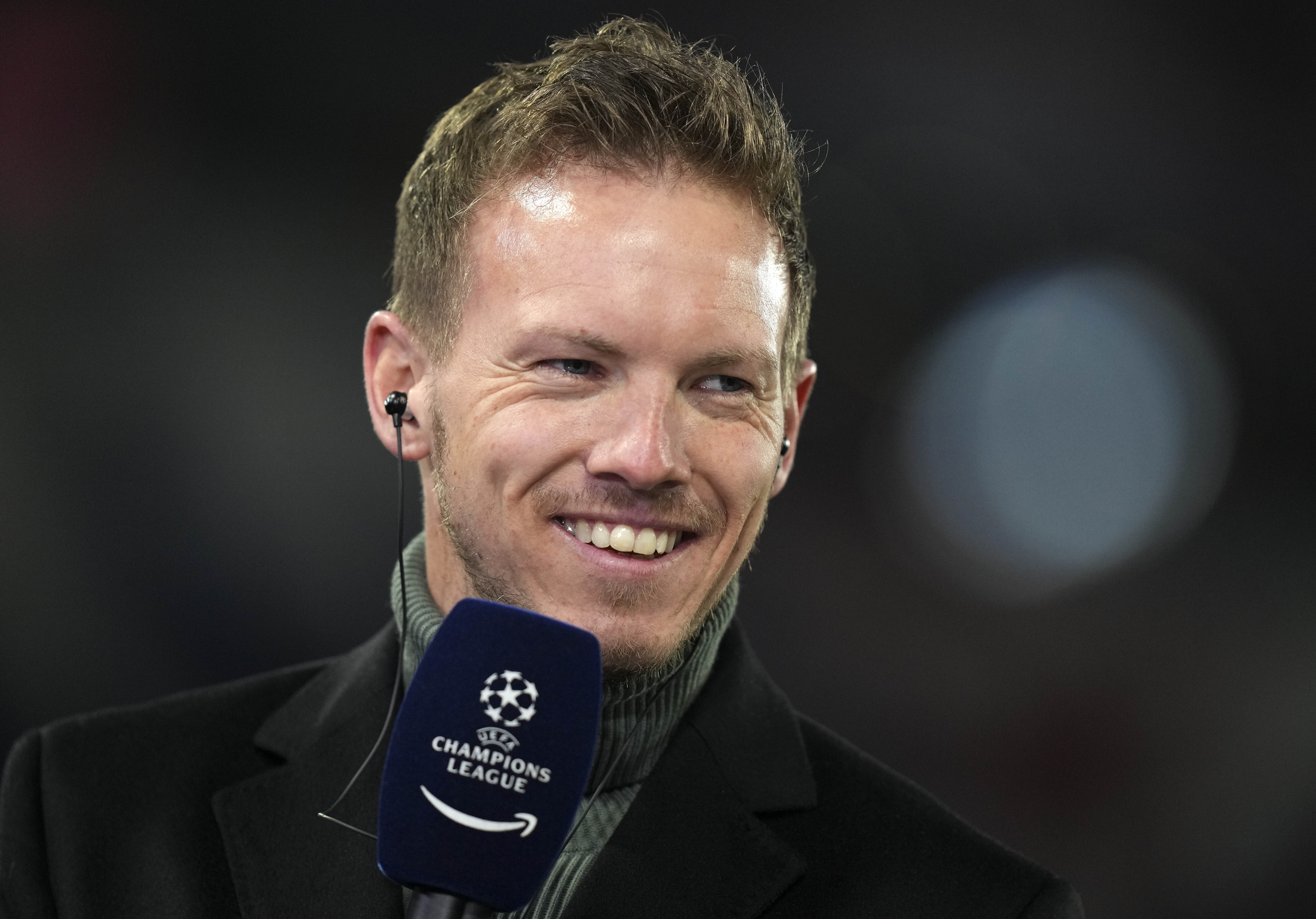 FILE - Then Bayern's head coach Julian Nagelsmann smiles during an interview prior the Champions League, round of 16, second leg soccer match between Bayern and Salzburg in Munich, Germany, Tuesday, March 8, 2022. Germany has appointed former Bayern Munich coach Julian Nagelsmann to lead the men’s national soccer team. The German soccer federation says Nagelsmann is taking over on a short-term contract through the European Championship next summer. Germany is hosting the tournament.