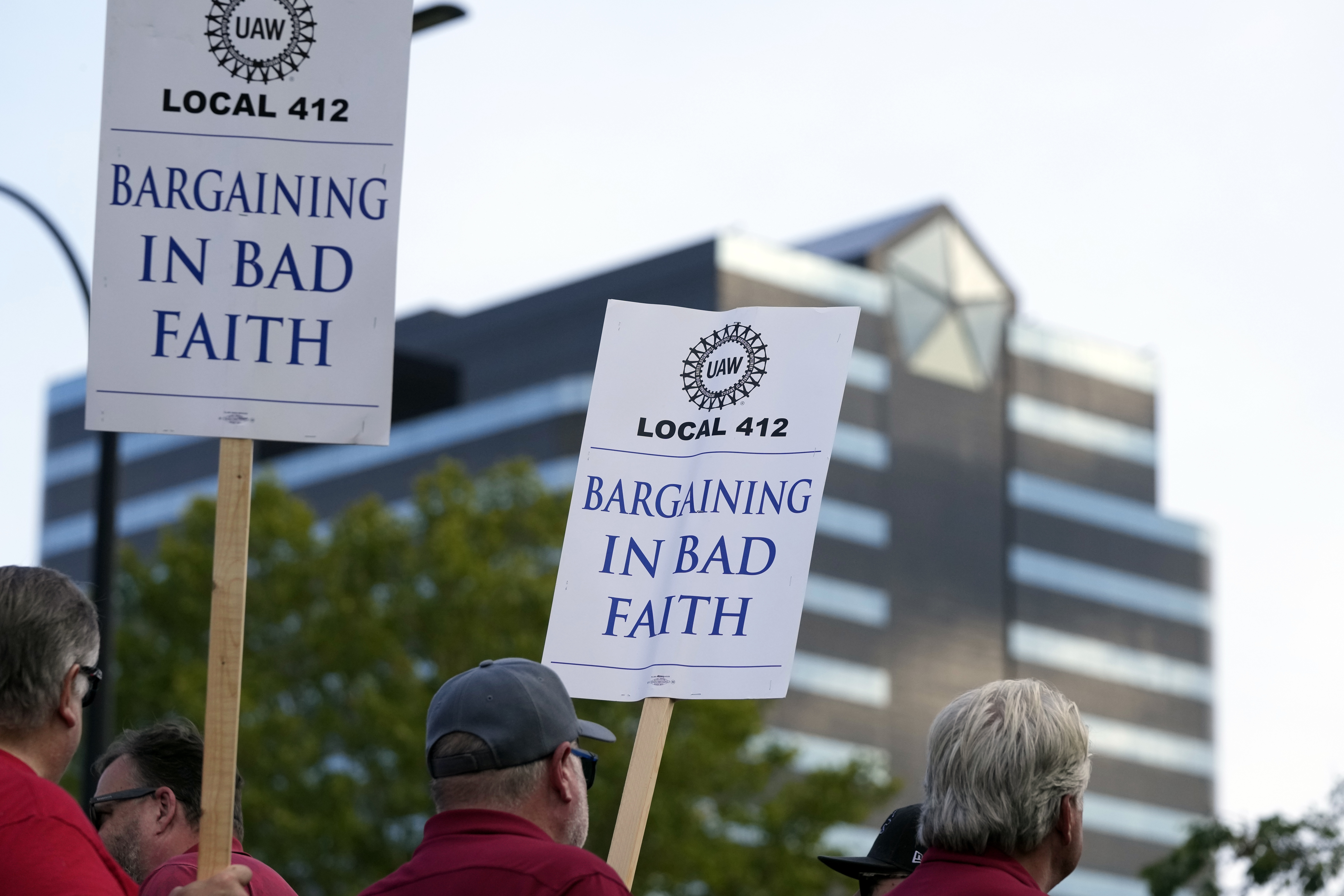 United Auto Workers march outside the Stellantis North American Headquarters, Wednesday in Auburn Hills, Mich.