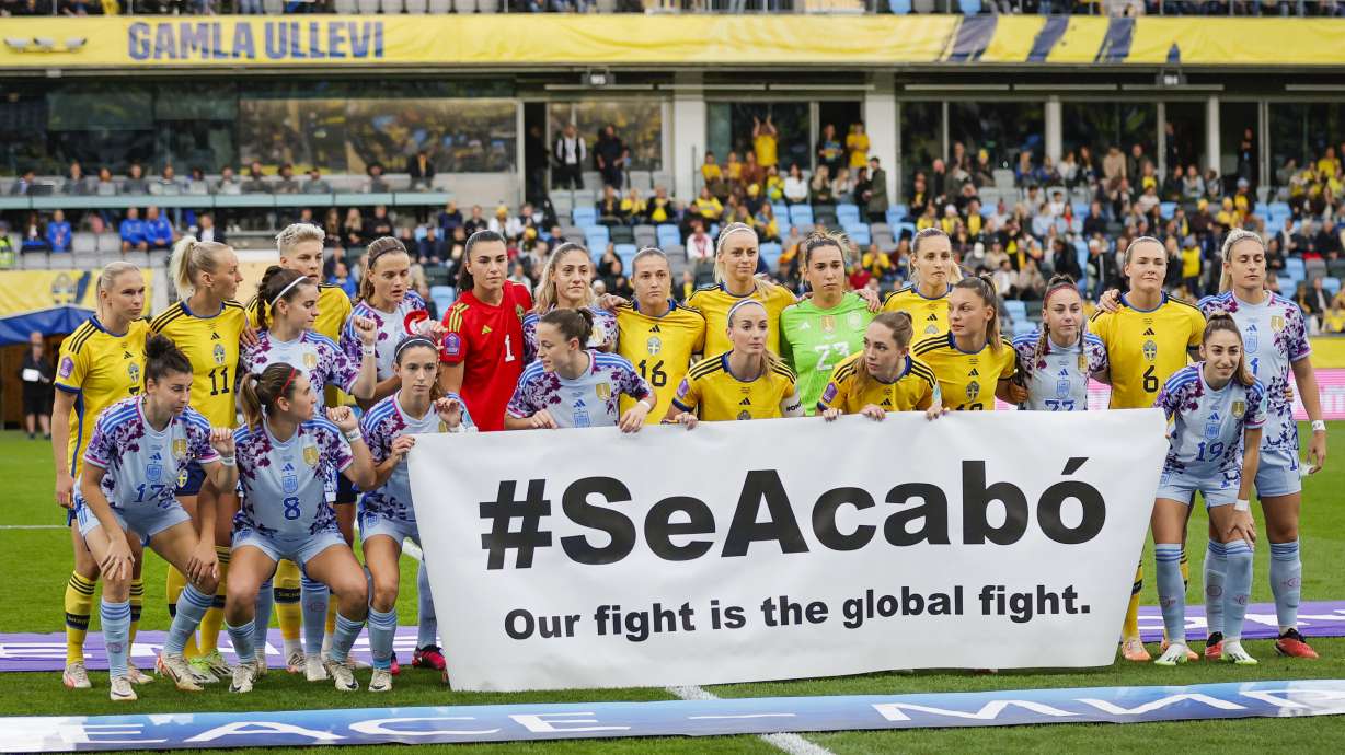 The Swedish and Spanish teams hold a banner reading '#SeAcabó - Our fight is the global fight' before the Women's Nations League soccer match between Sweden and Spain at Gamla Ullevi in Gothenburg, Sweden, Friday Sept. 22, 2023.