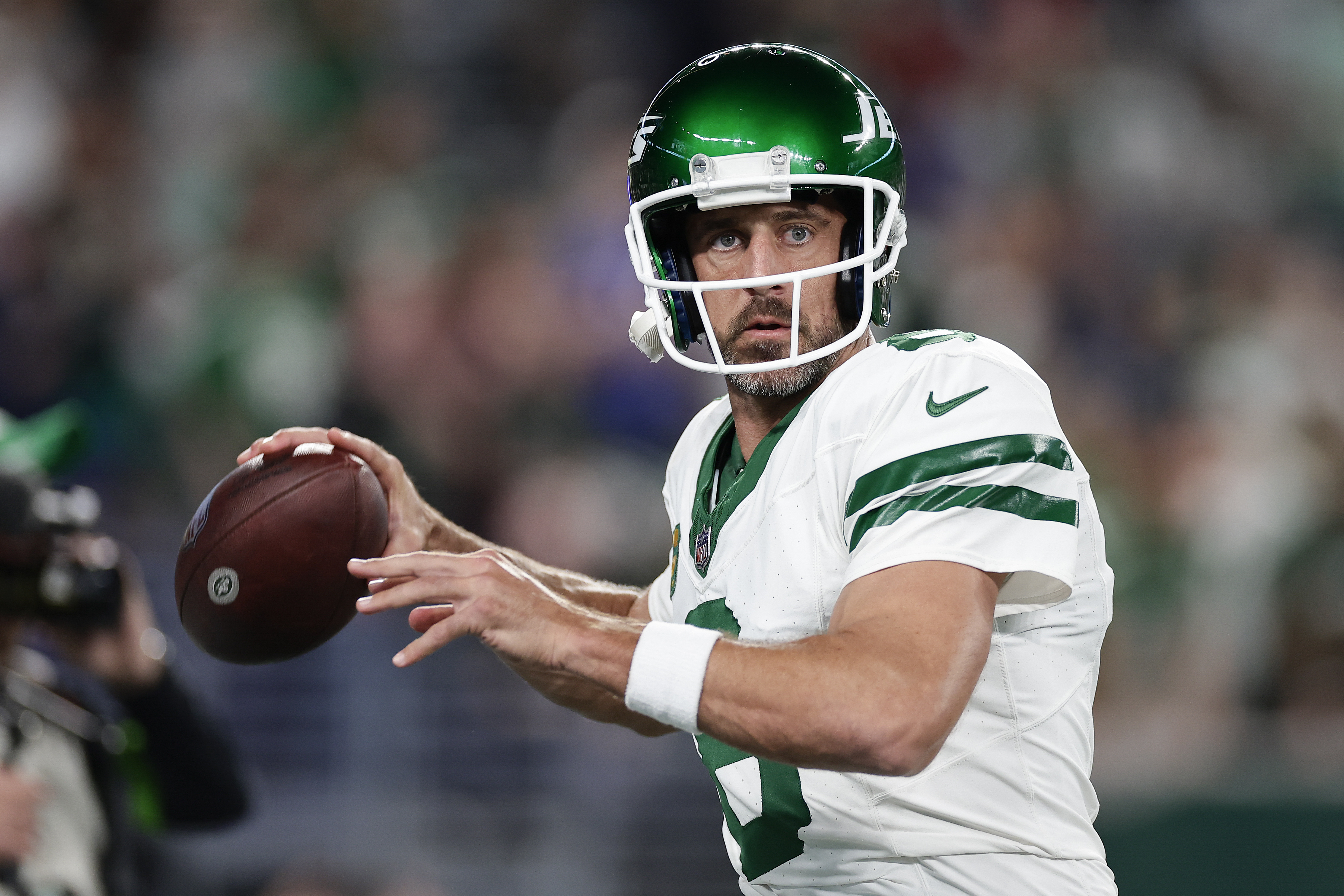 New York Jets quarterback Aaron Rodgers (8) warms up before playing against the Buffalo Bills in an NFL football game, Monday, Sept. 11, 2023, in East Rutherford, N.J.
