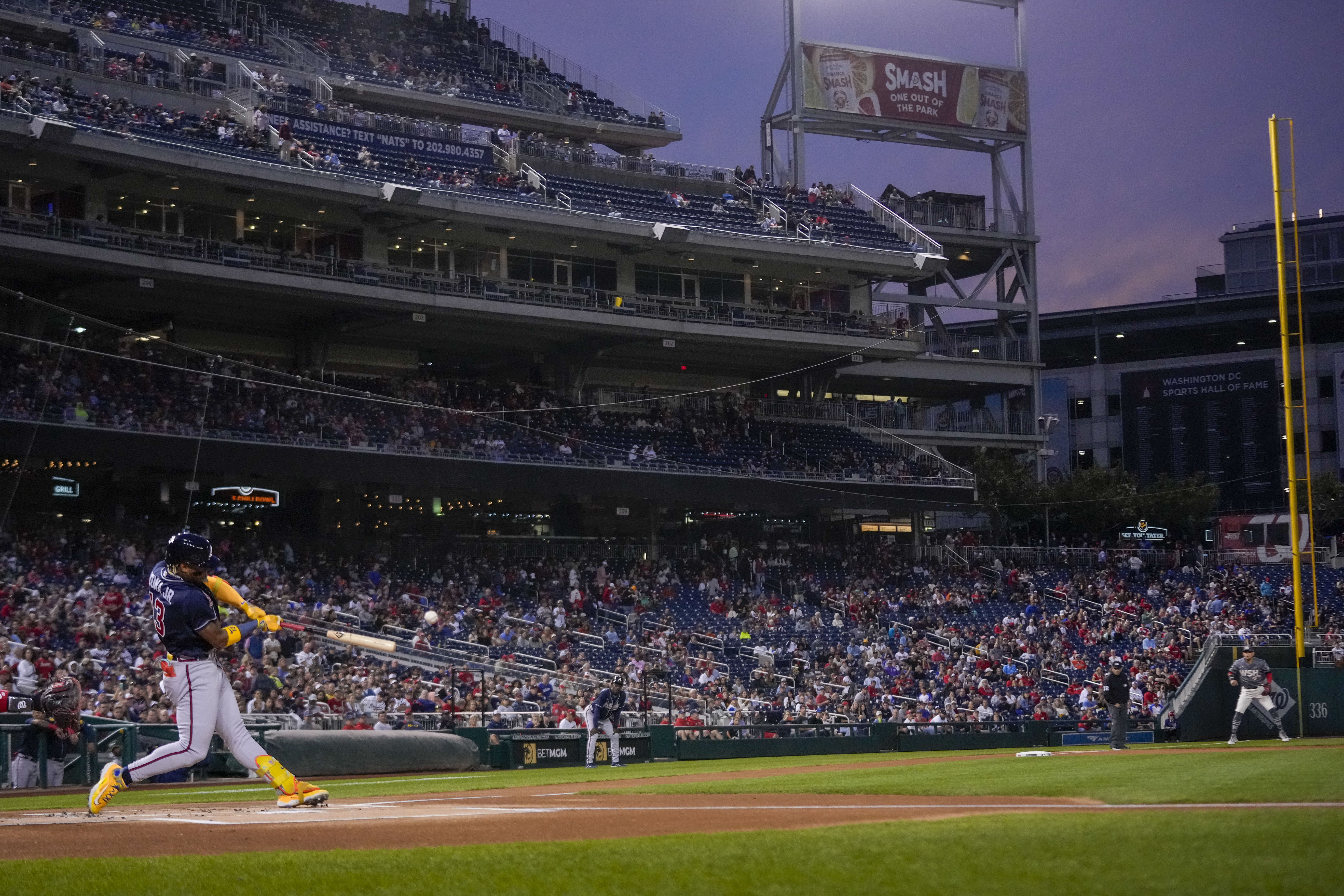 Atlanta Braves' Ronald Acuna Jr. hits a solo home run during the first inning of a baseball game against the Washington Nationals at Nationals Park, Friday, Sept. 22, 2023, in Washington. With the hit, Acuna became the fifth player in MLB history with 40 home runs and 40 stolen bases in a season.