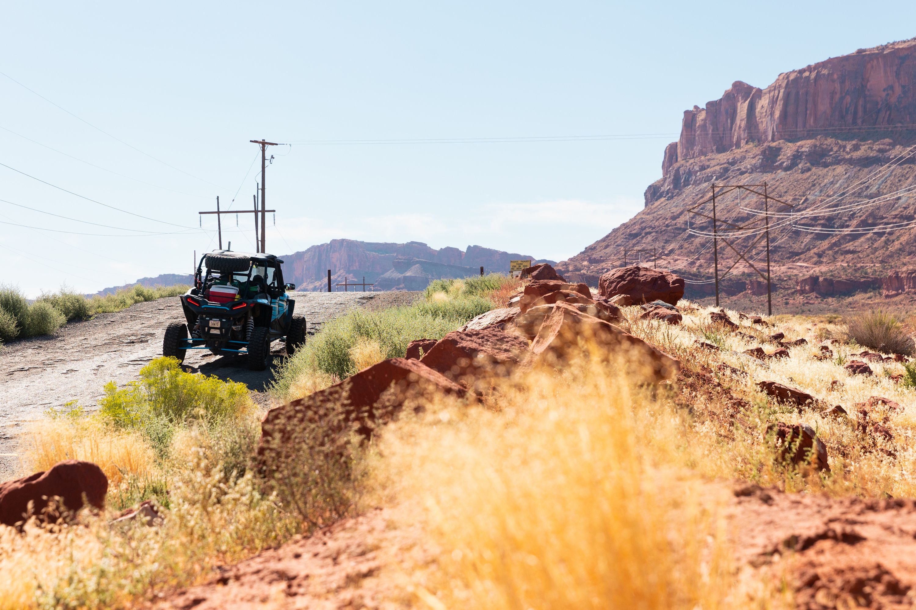 An ATV drives on the road towards Gemini Bridges, one of the areas that will be impacted by the Labyrinth Canyon and Gemini Bridges Travel Plan, in Moab on Friday. The travel management plan from the Bureau of Land Management, which covers 300,00 acres near Moab, will be released by Sept. 30.