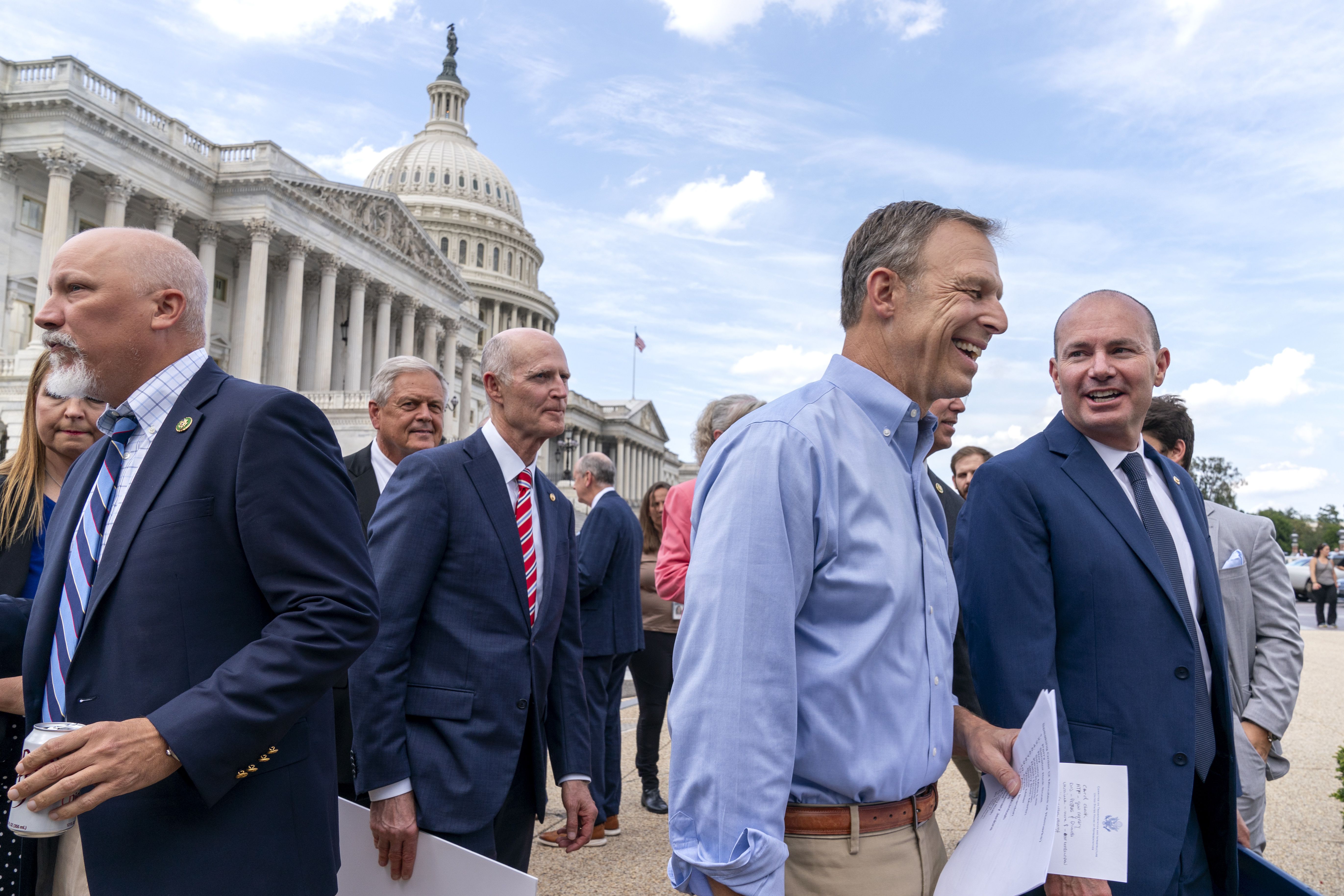 Rep. Chip Roy, R-Texas, left, Sen. Rick Scott, R-Fla., Rep. Scott Perry, R-Pa., and Rep. Mike Lee, R-Utah, right, join lawmakers from the conservative House Freedom Caucus, the conservatives who are challenging Speaker McCarthy on the government funding bill, for a news conference outside the Capitol in Washington, Sept. 12.