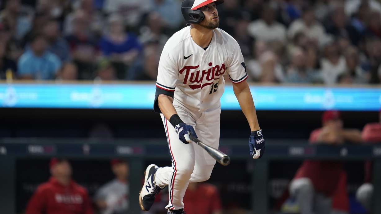 Minnesota Twins' Alex Kirilloff watches his solo home run during the sixth inning of a baseball game against the Los Angeles Angels, Friday, Sept. 22, 2023, in Minneapolis.
