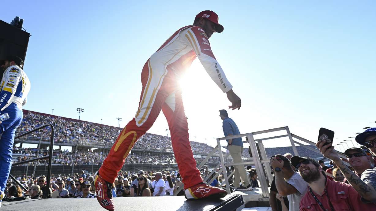 Bubba Wallace greets fans prior to a NASCAR Cup Series auto race at Darlington Raceway, Sunday, Sept. 3, 2023, in Darlington, S.C.